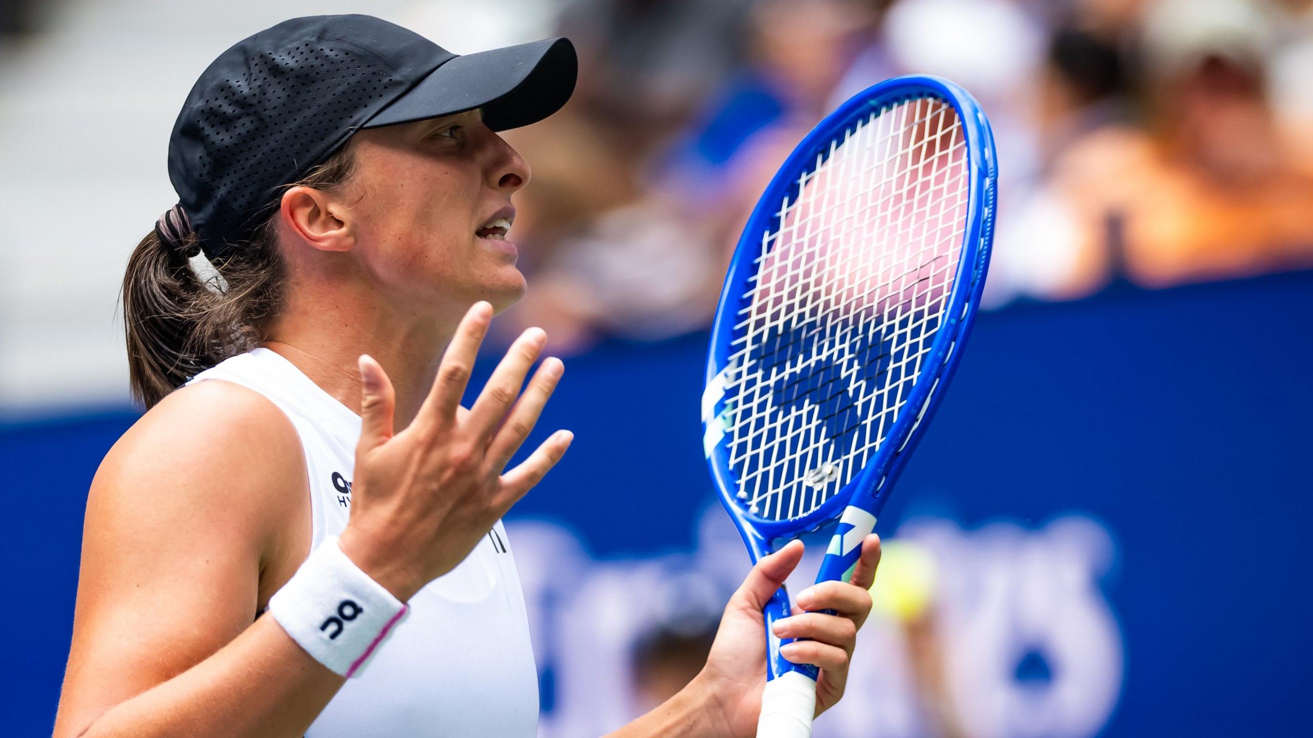Iga Swiatek reacts with frustration during her US Open second round match