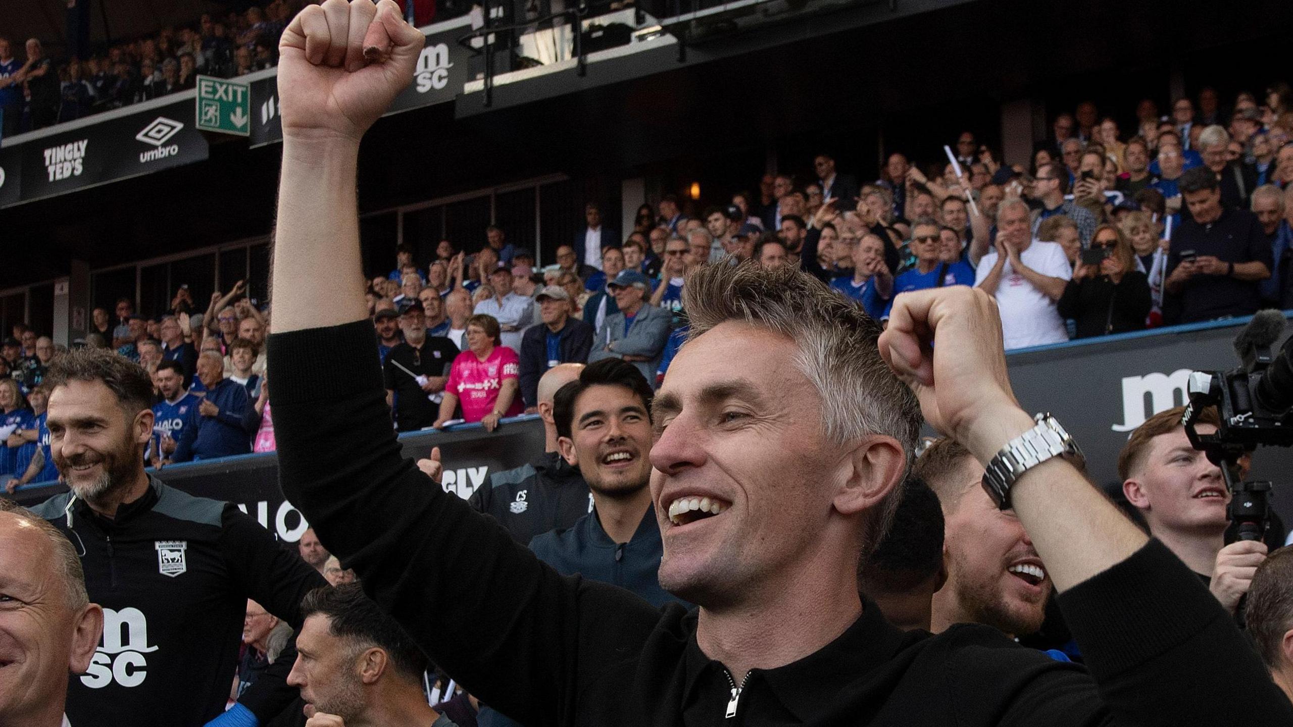 Kieran McKenna celebrates winning his third promotion in four years with Ipswich.