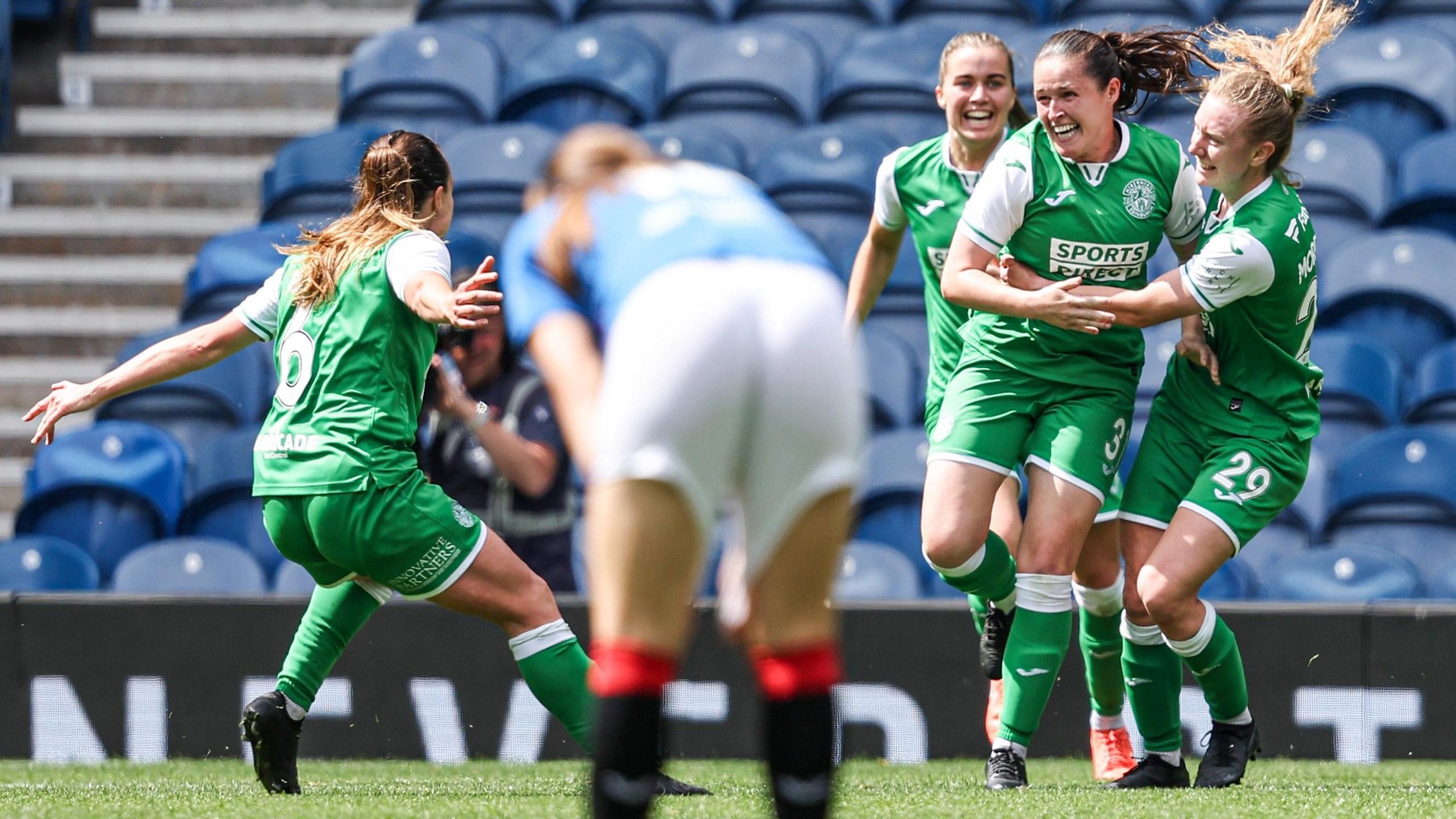 Hibs celebrate scoring against Rangers at Ibrox