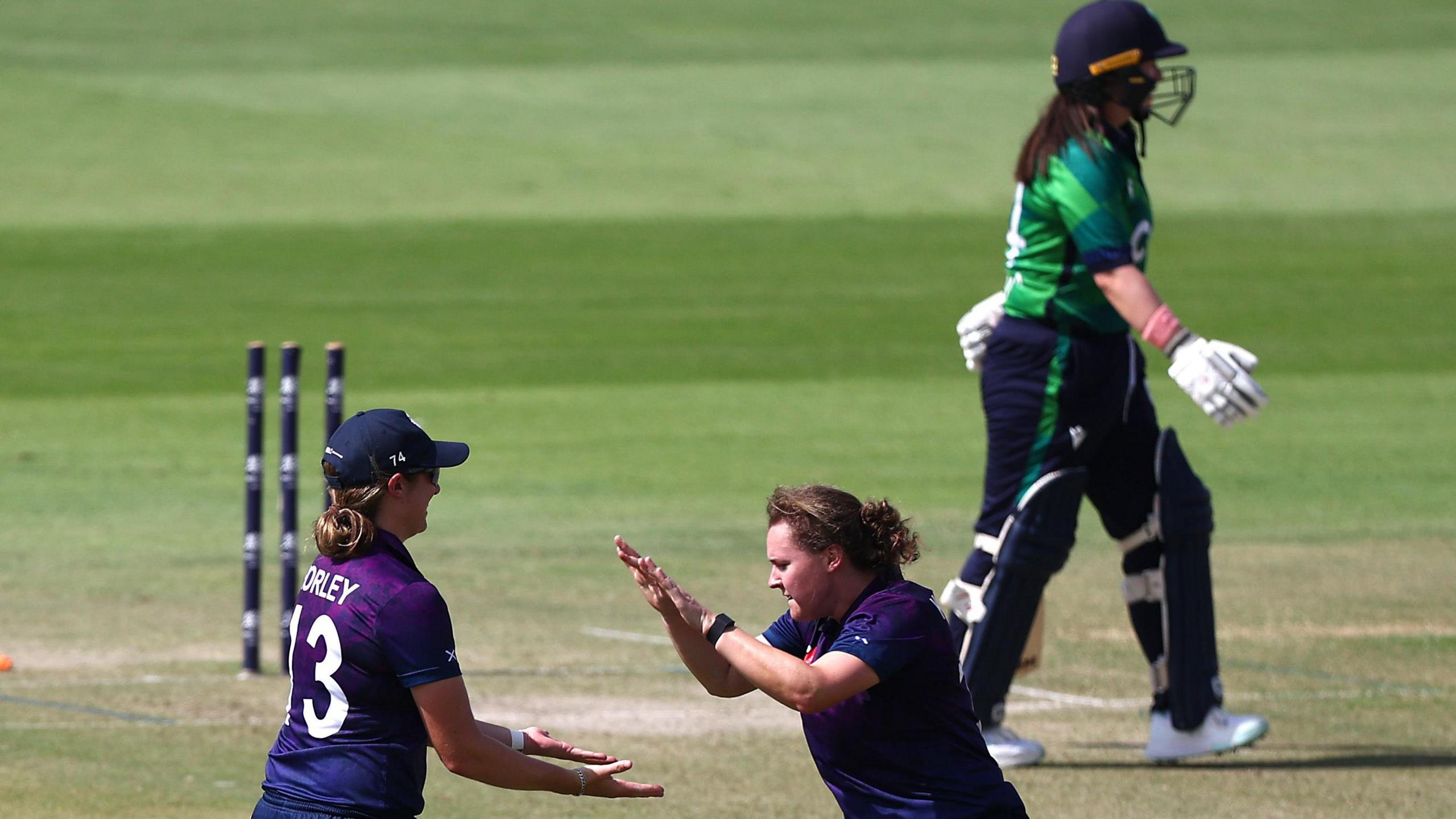 Kathryn Bryce celebrates with Saskia Horley after bowling Ireland skipper Laura Delany