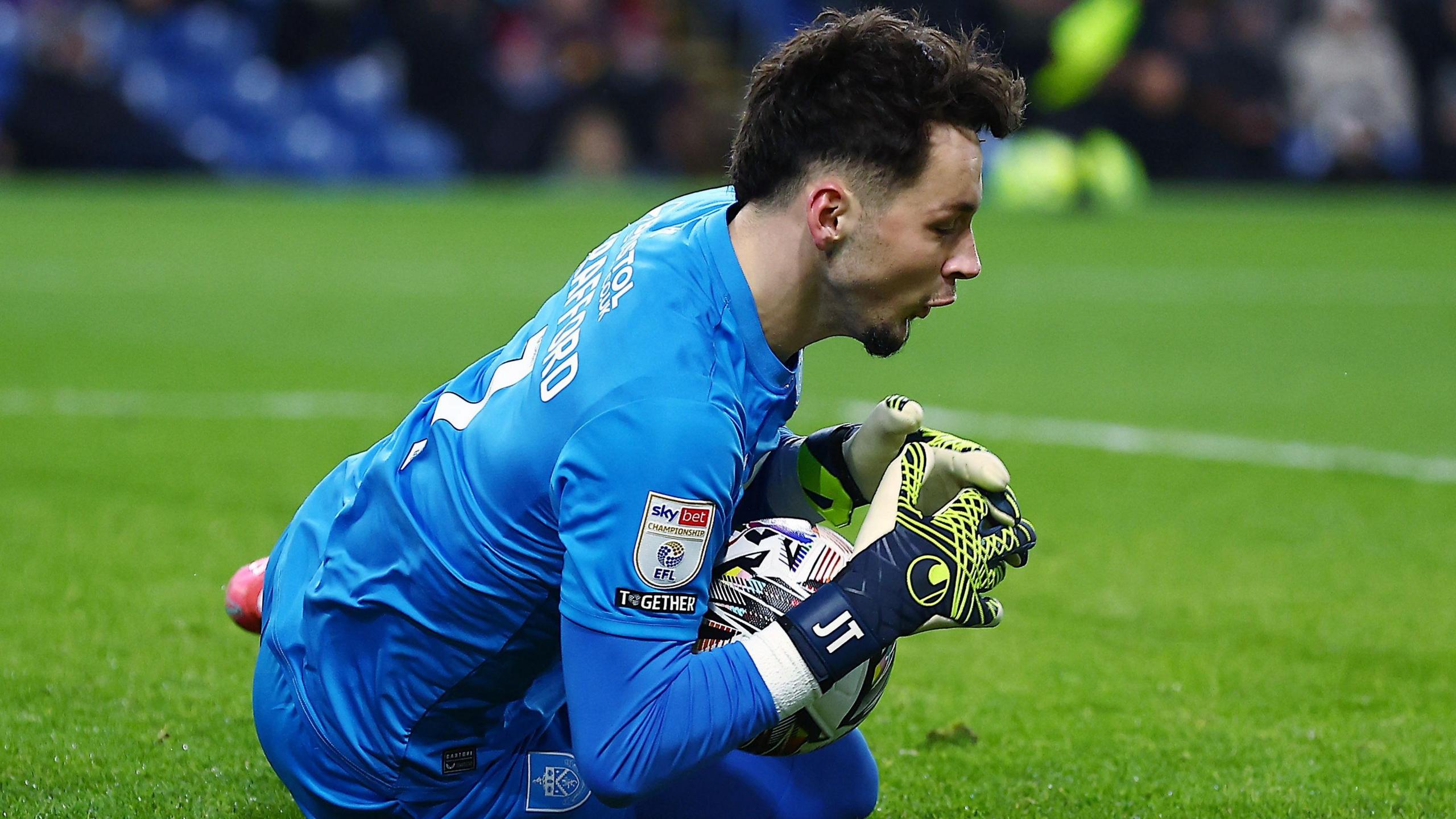 Burnley goalkeeper James Trafford making a save.