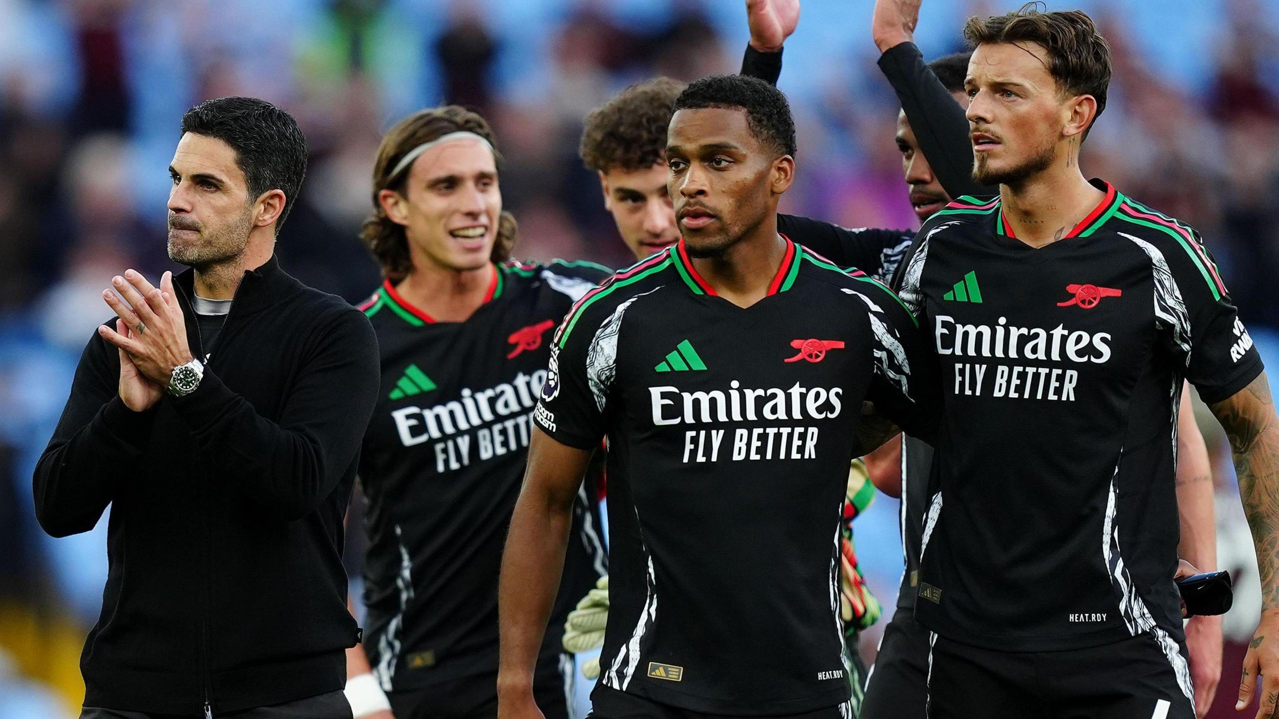 Arsenal manager Mikel Arteta and his players celebrate after victory at Aston Villa