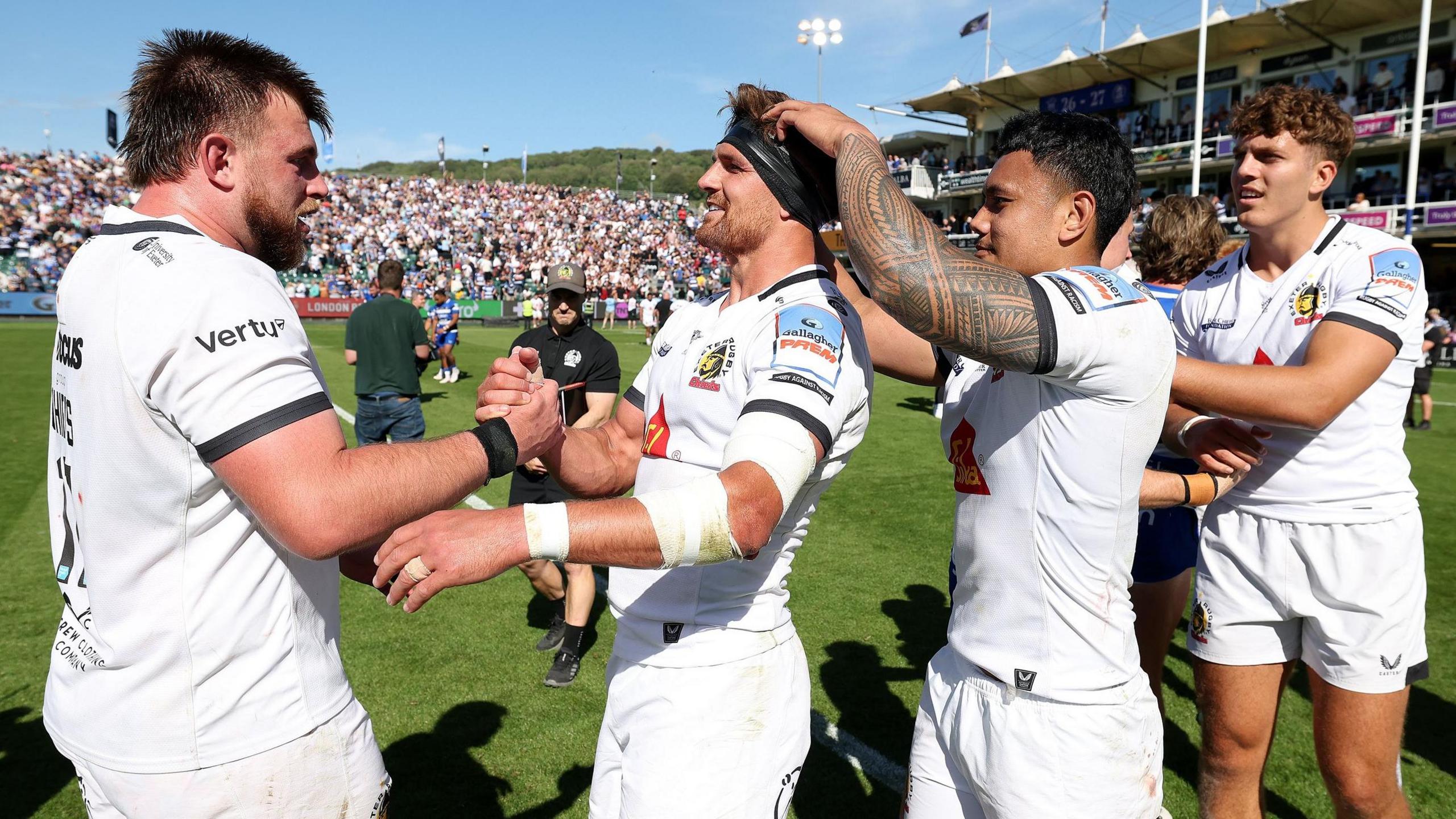 Exeter players celebrate winning at Bath