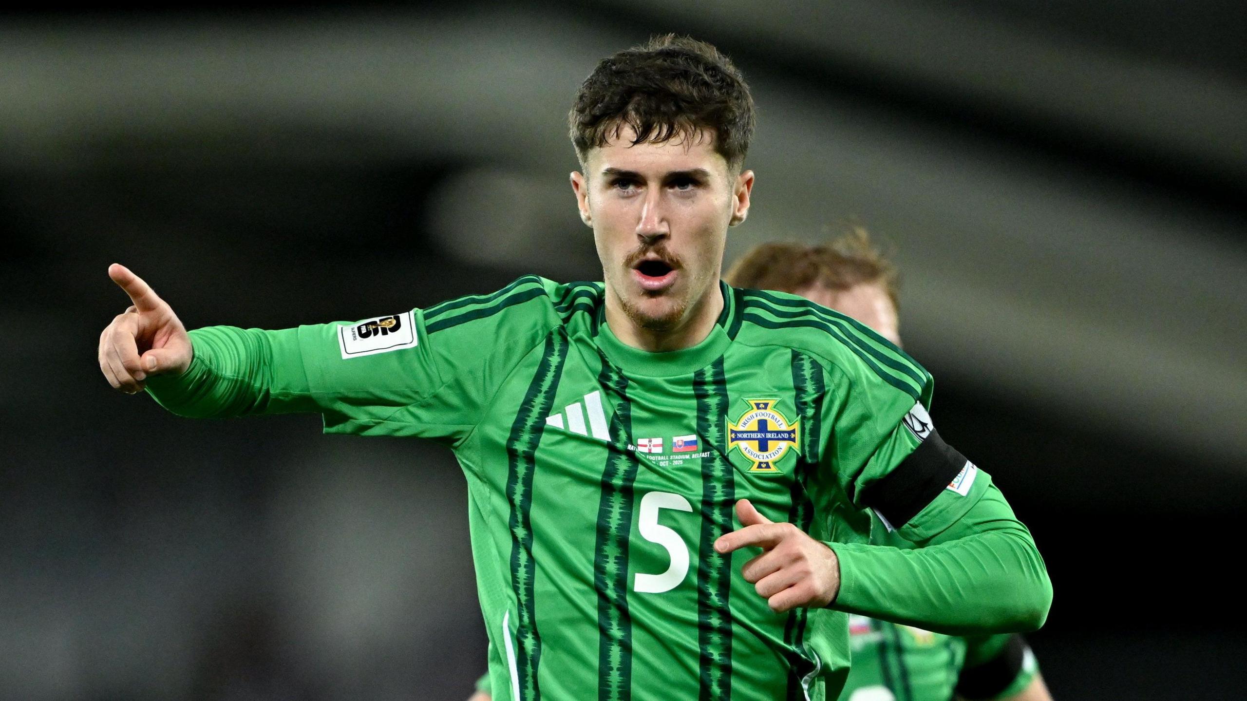 Trai Hume celebrates in Northern Ireland action