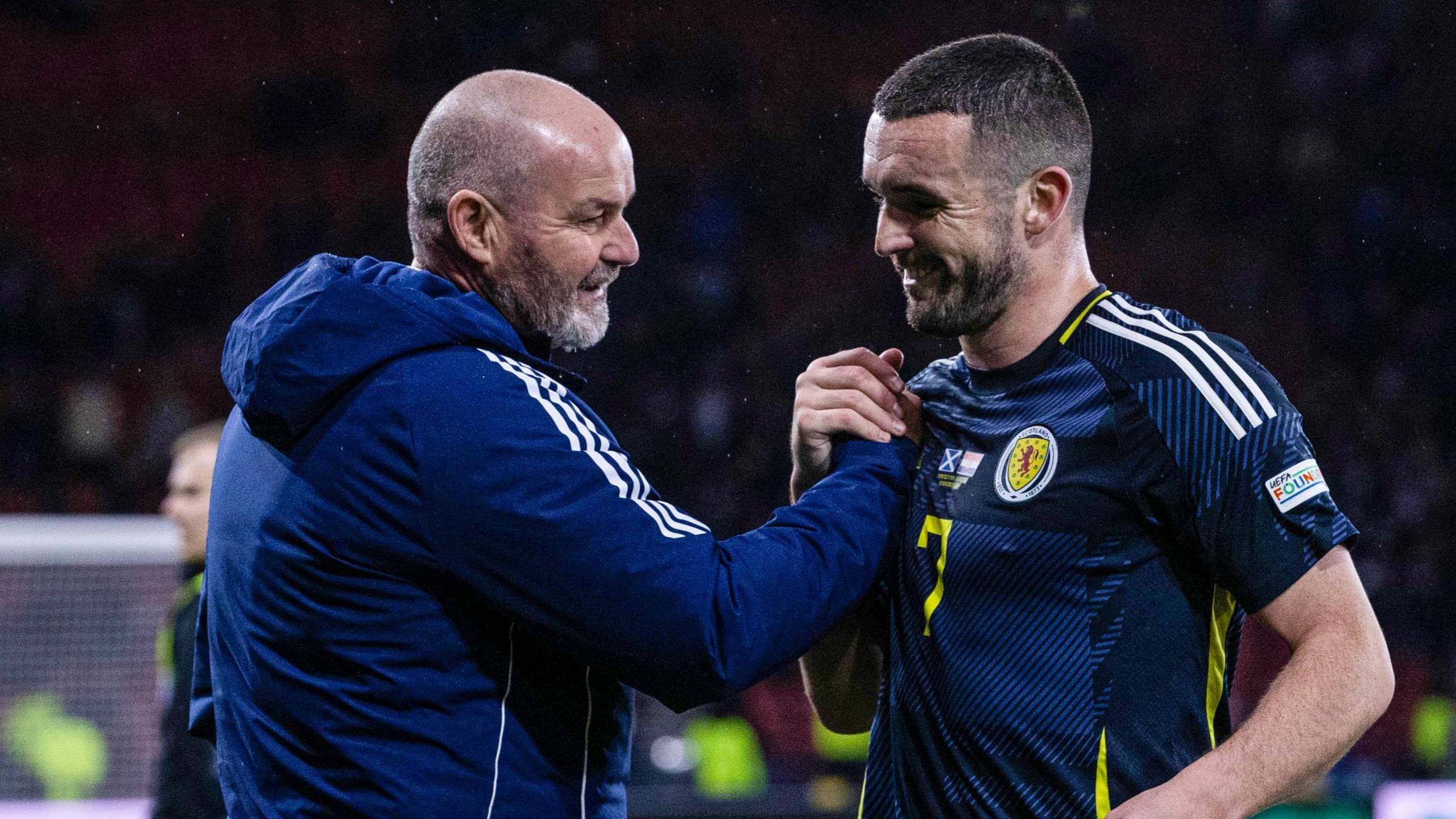 Steve Clarke celebrates with John McGinn after Scotland's win against Croatia