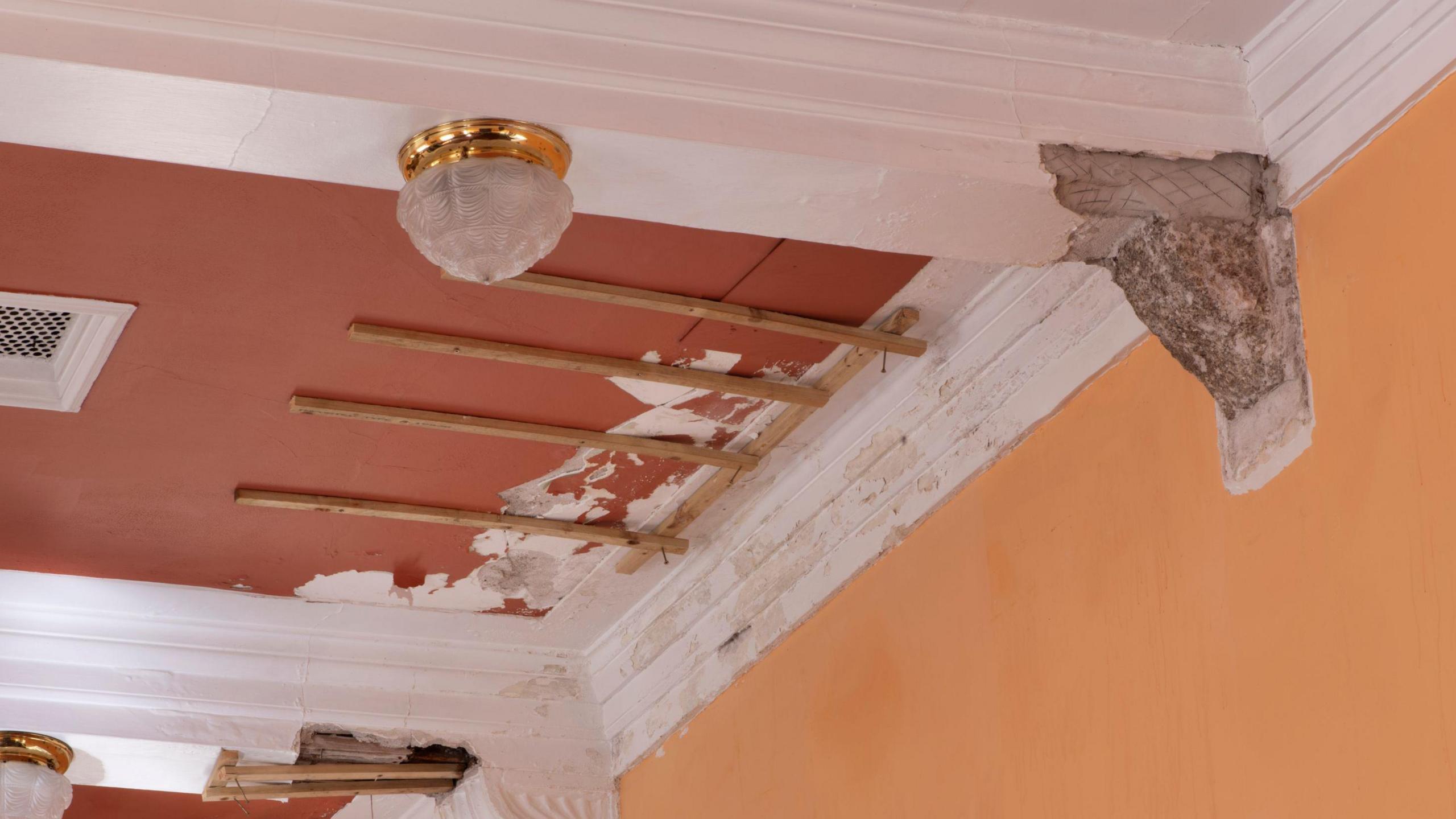 Detail of the water-damaged ceiling in the council chamber on the first-floor of the Guildhall, from the south.