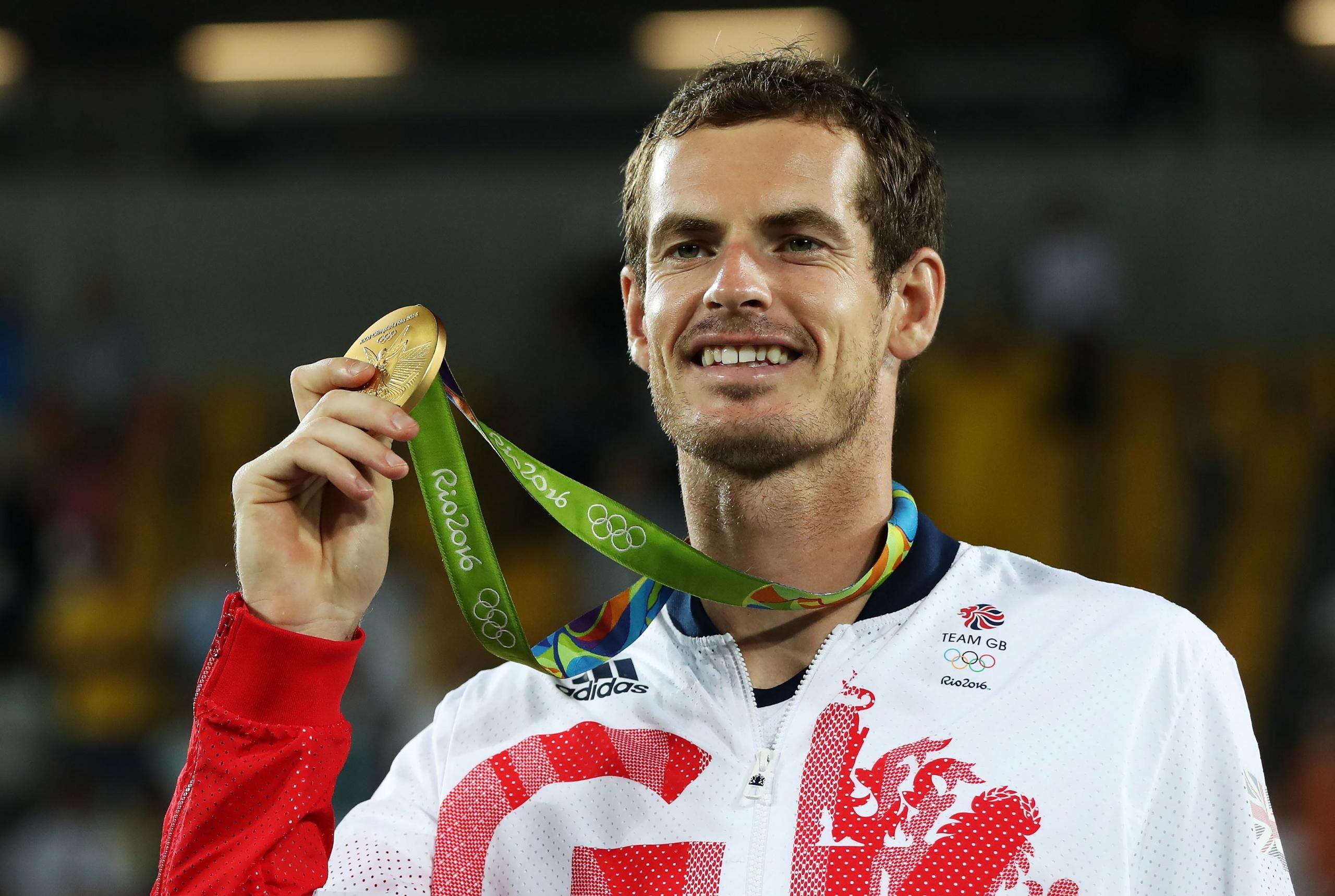 Andy Murray holds up the gold medal he won ay Rio 2016