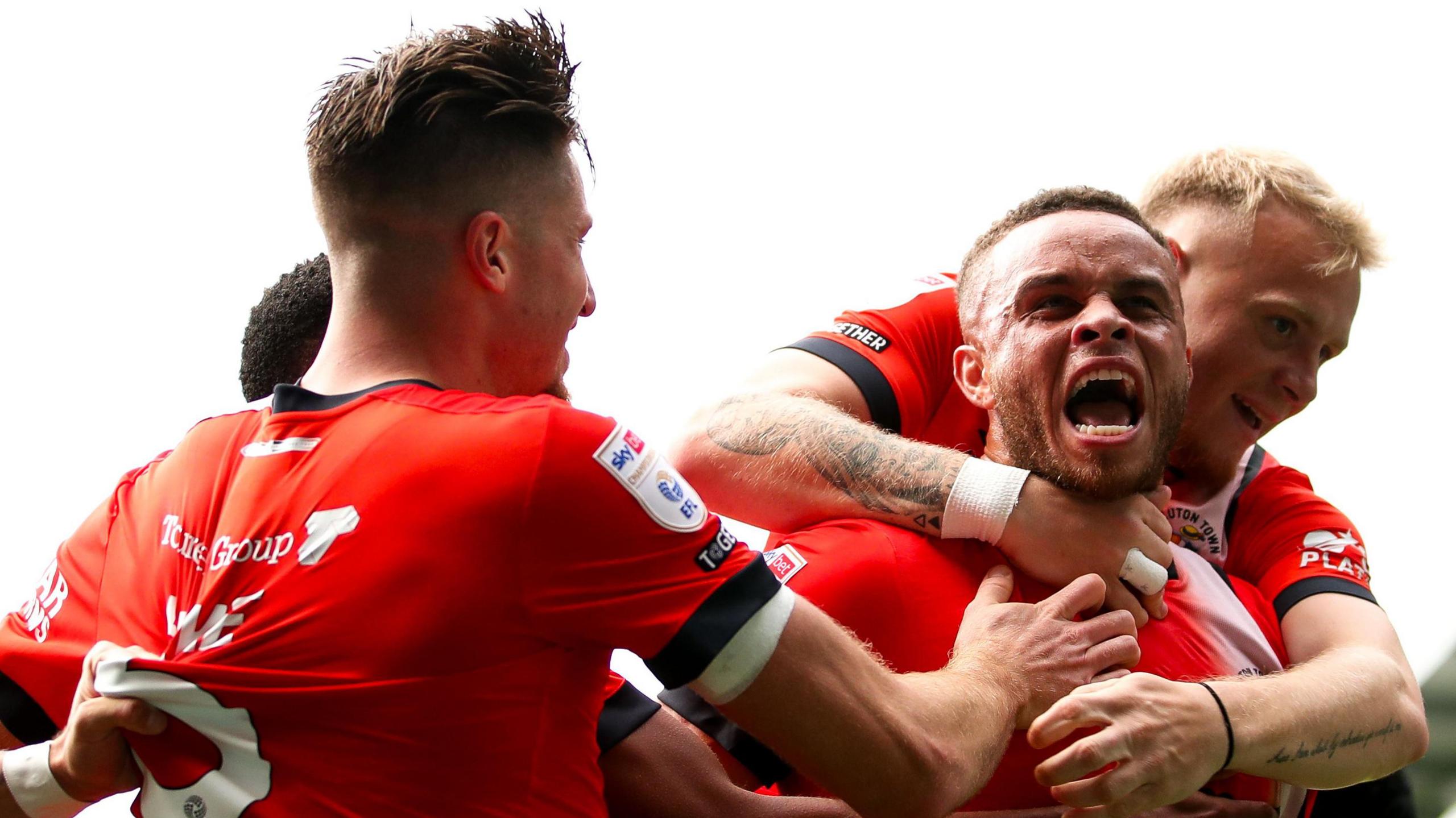 Luton Town's Carlton Morris (second right) celebrates with teammates after scoring his side's second goal of the game during the Sky Bet Championship match at Kenilworth Road, Luton. Picture date: Saturday September 21,