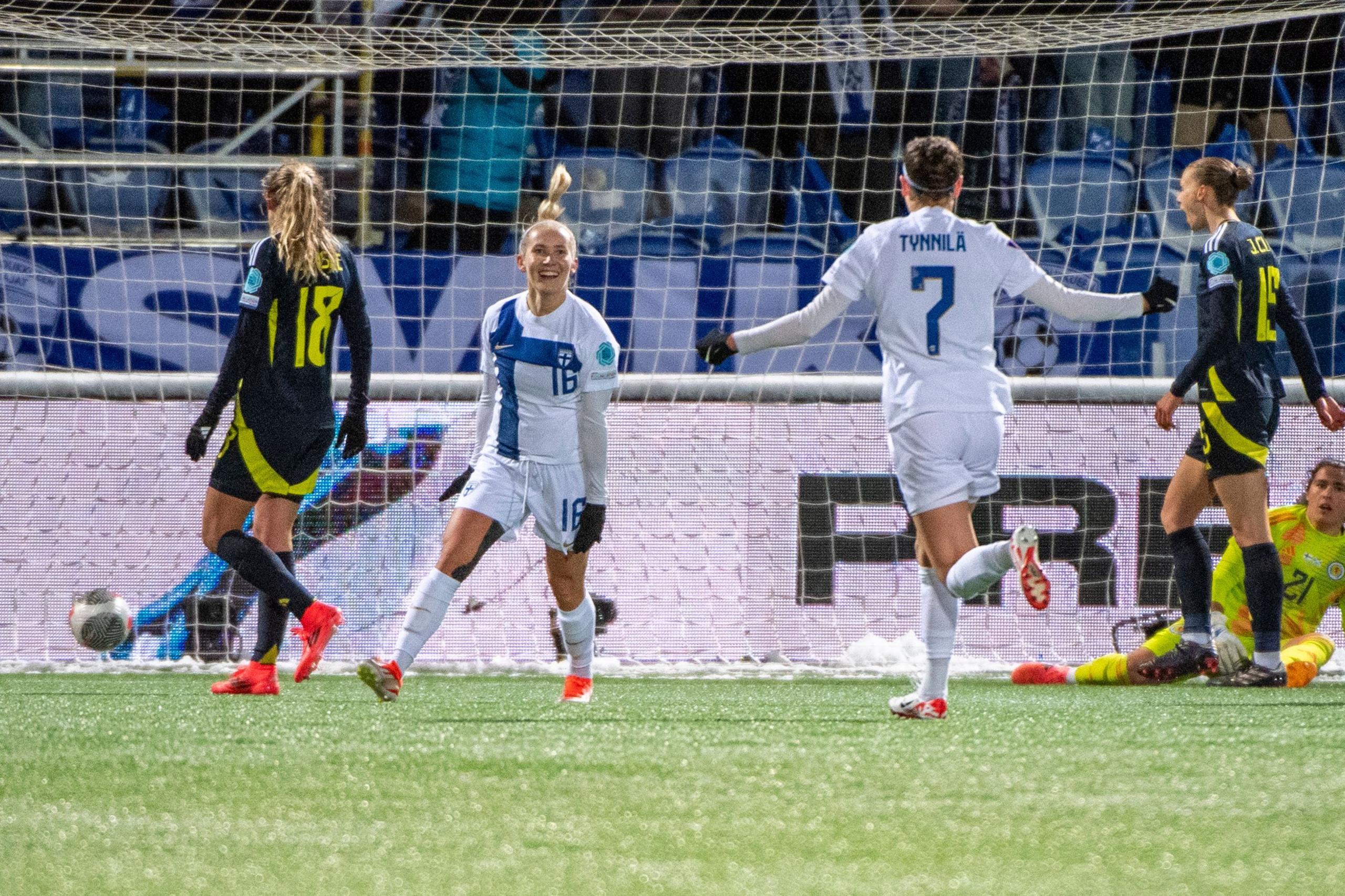 Finland celebrate after scoring against Scotland