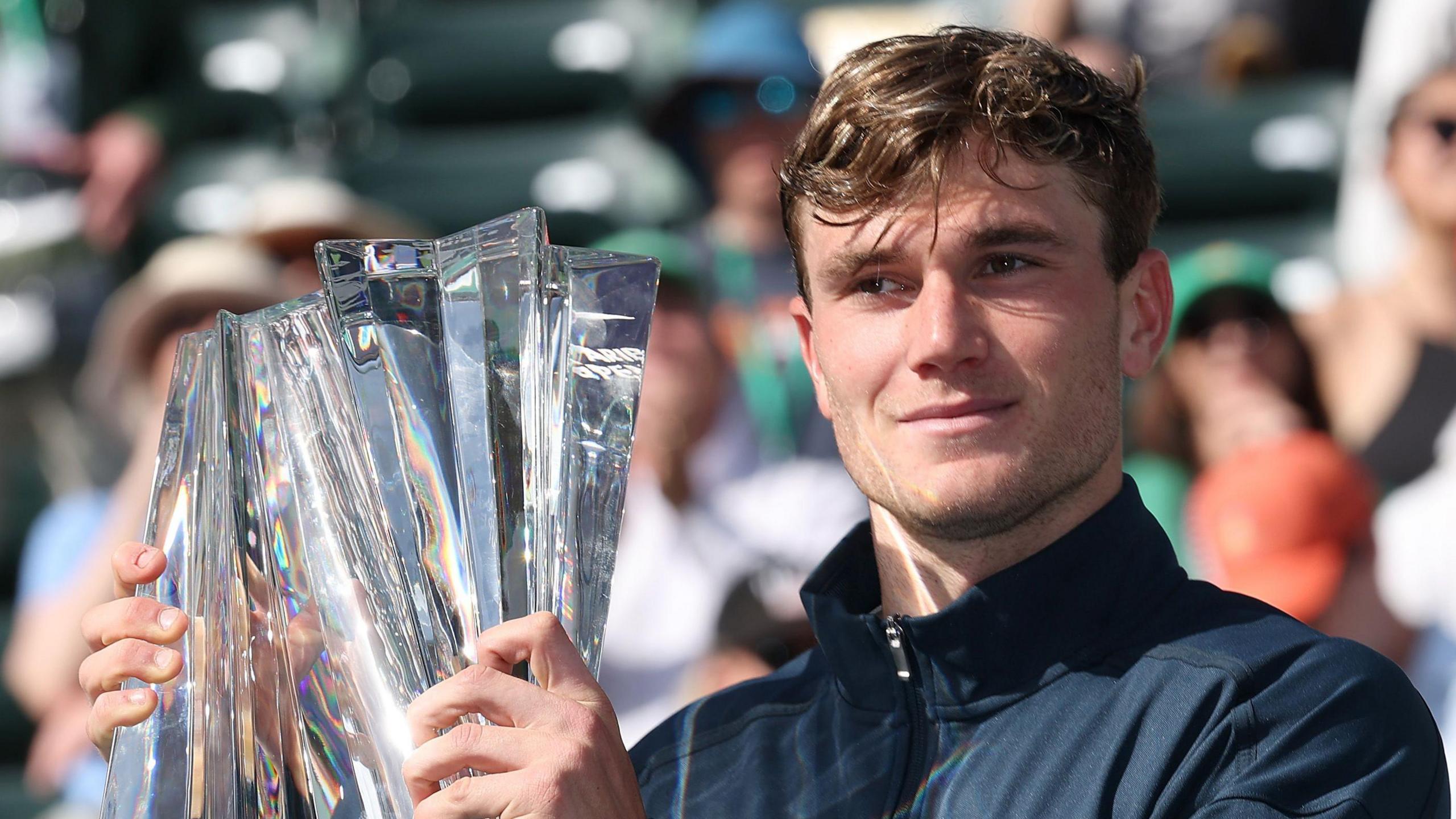 Jack Draper lifts the Indian Wells trophy