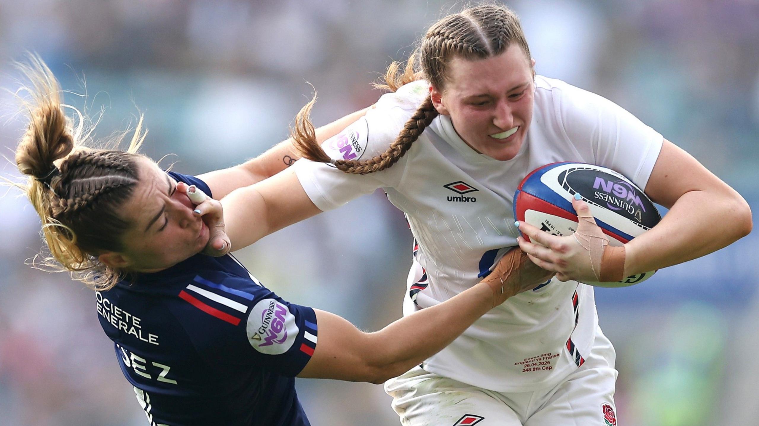 England full-back Emma Sing hands off France's Joanna Grisez