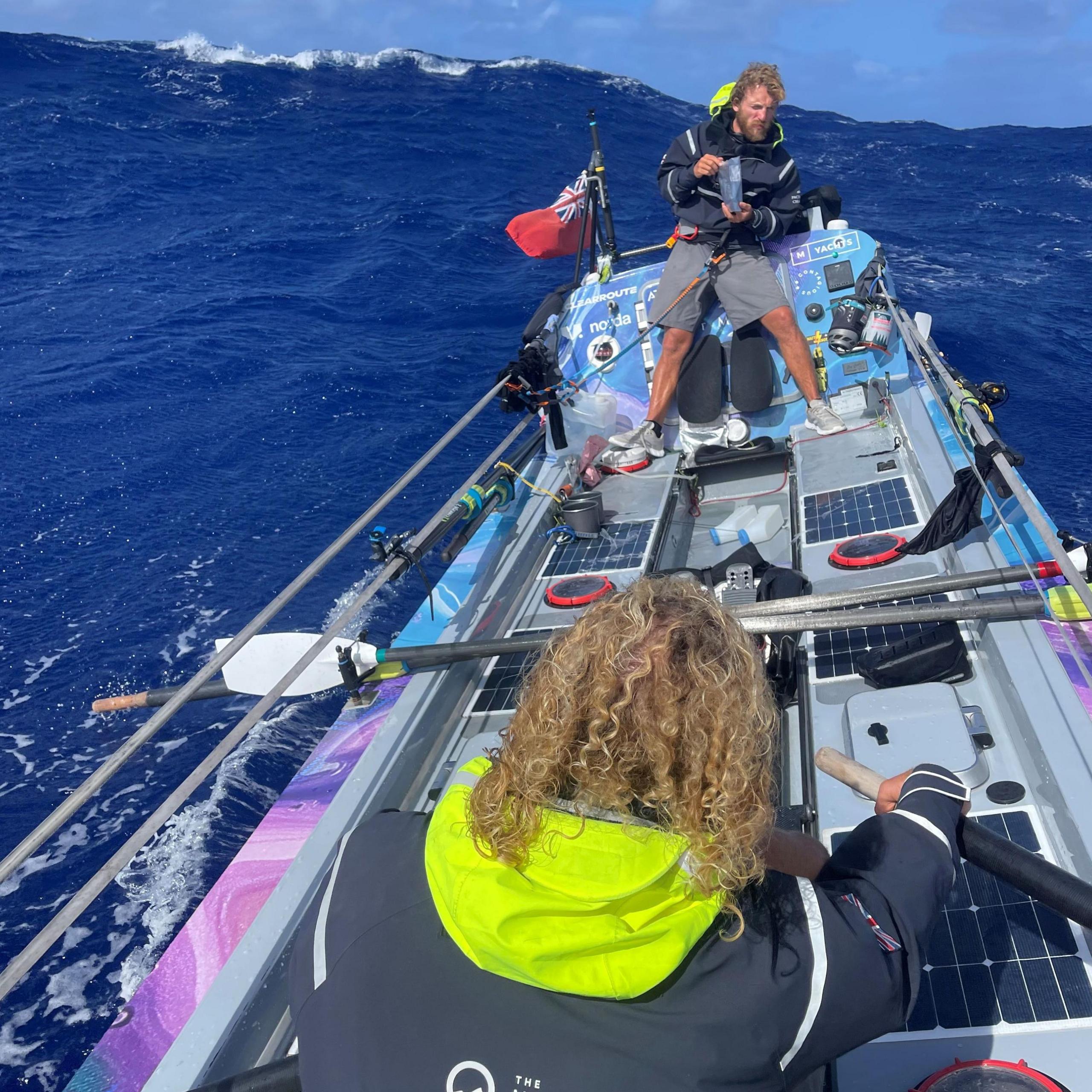 Two of the brothers are in the small boat while at sea.