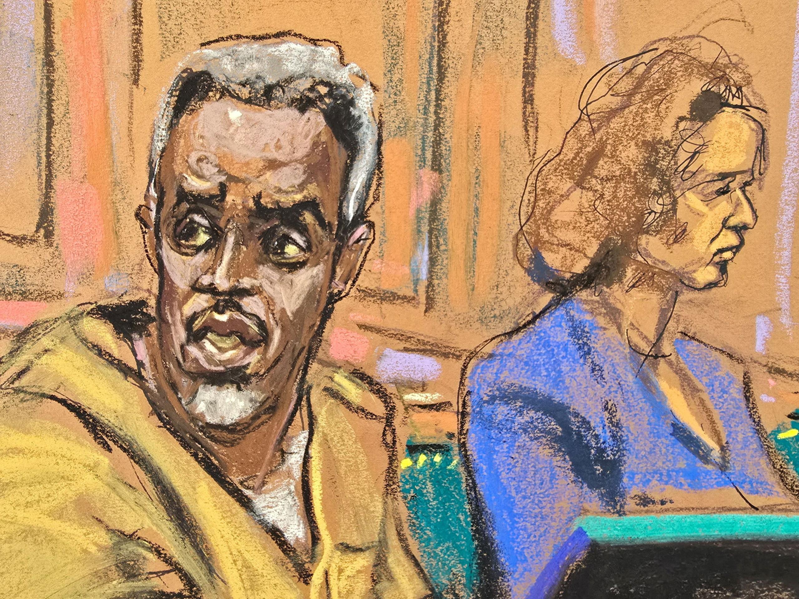 A court sketch of Sean 'Diddy' Combs talking to his lawyer. His eyes look heavy set and his hair is greying.