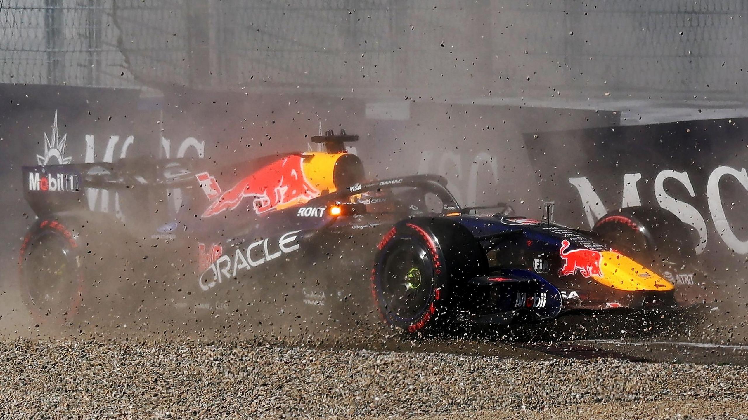 Red Bull's Max Verstappen throws up gravel as it crashes into the barrier during qualifying for the Austrian Grand Prix