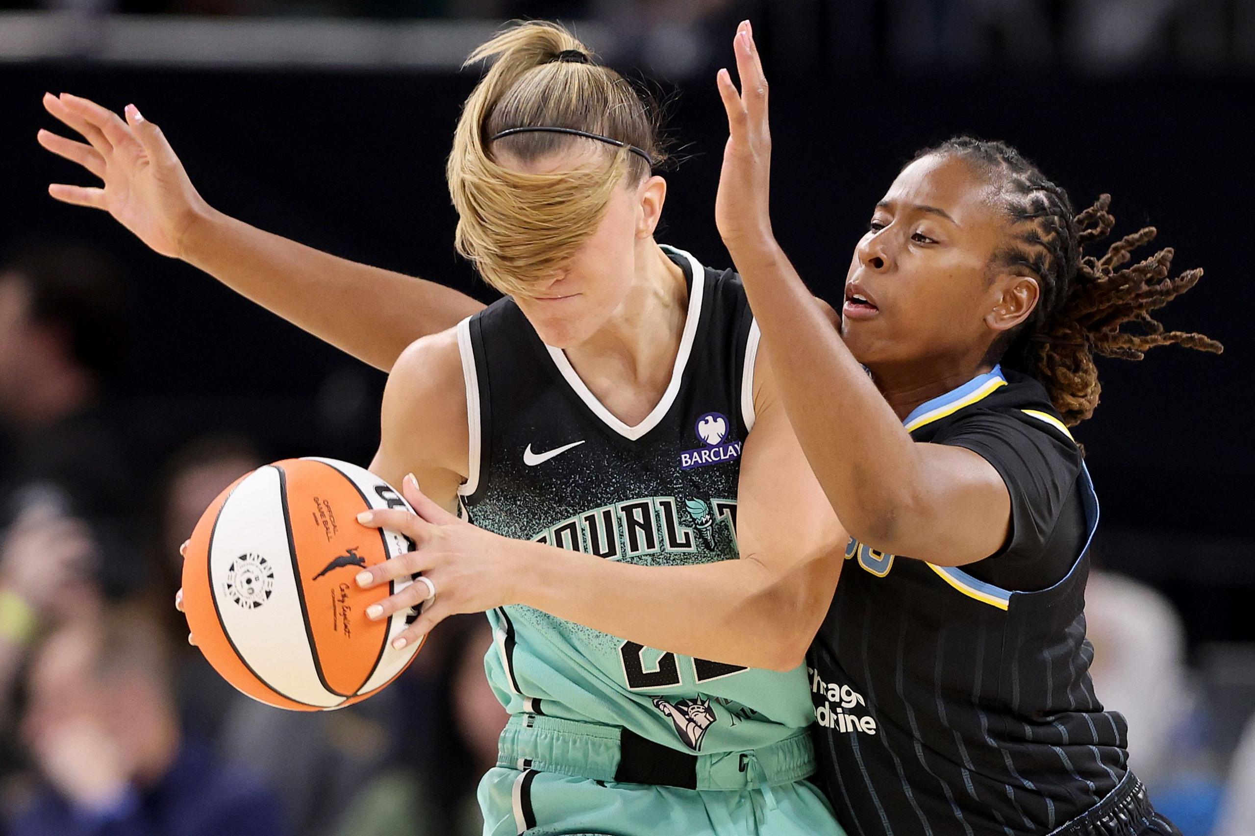 Chicago Sky's Ariel Atkins defends New York Liberty's Sabrina Ionescu during the first half at Wintrust Arena in Chicago, Illinois. Photo by Michael Reaves