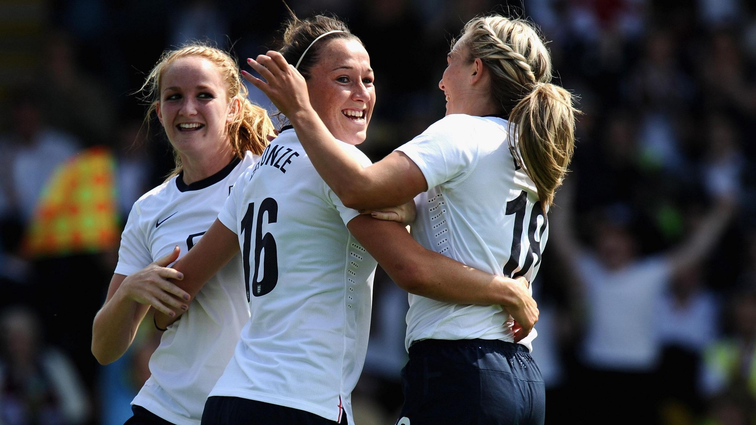 Lucy Bronze has a hug with her team-mates