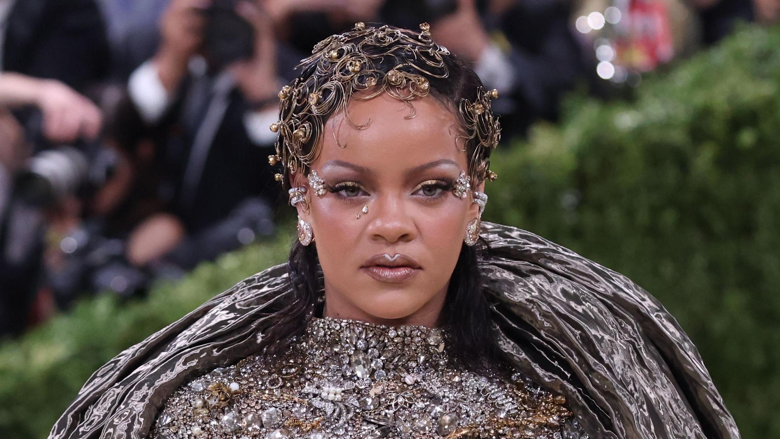 Rihanna is a silver, bejewelled outfit at the Met Gala.