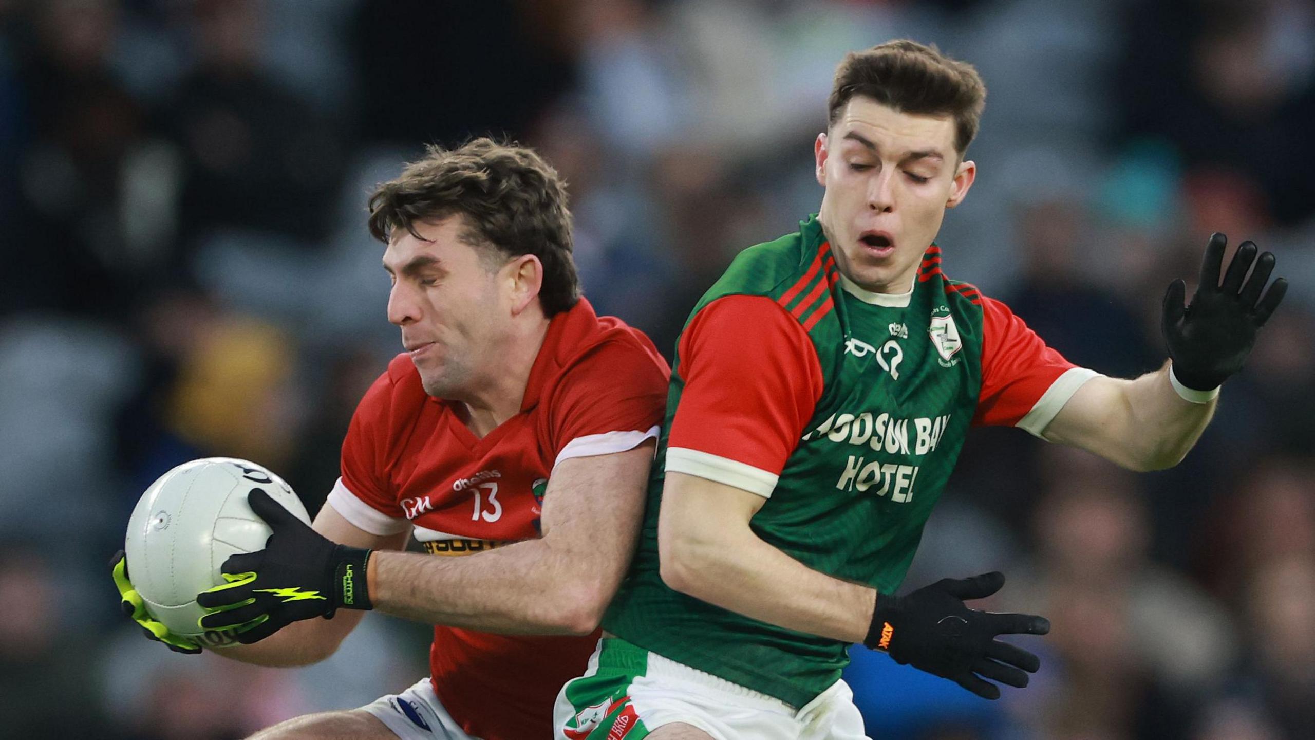 Conor Geaney and Bobby Nugent battle for possession 