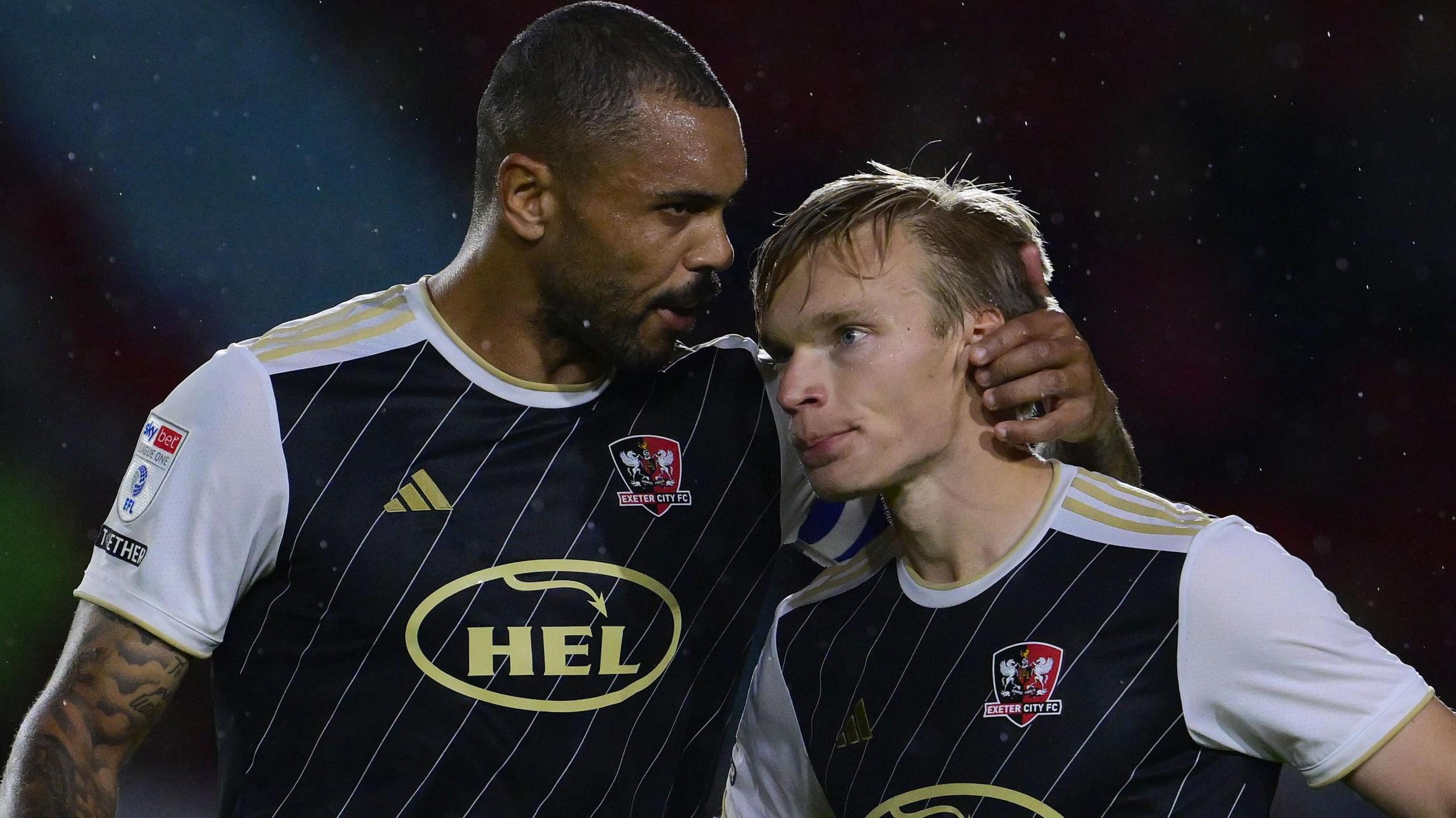 Exeter City duo Josh Magennis (left) and Ilmari Niskanen