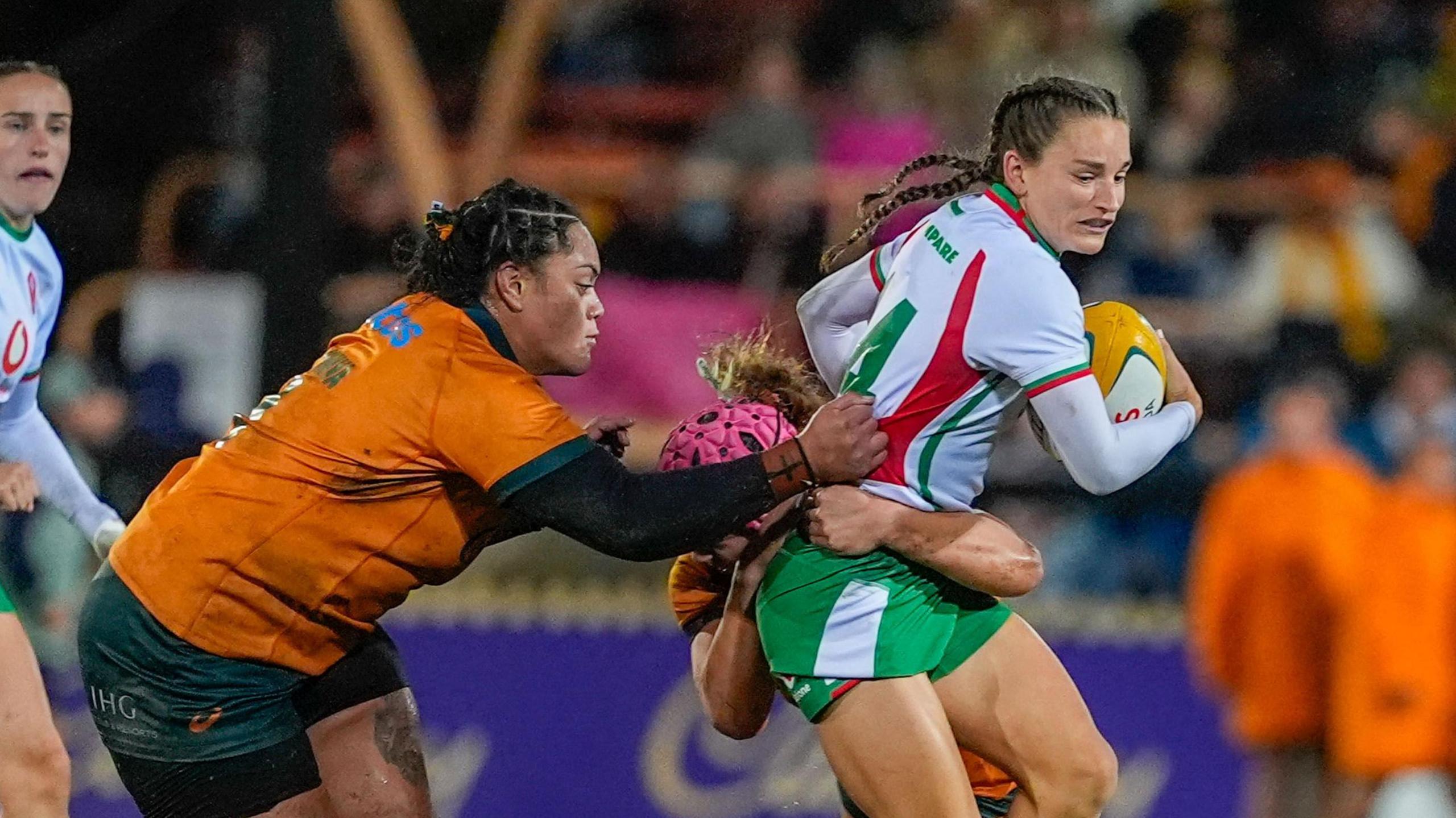 Jasmine Joyce of Wales is tackled 