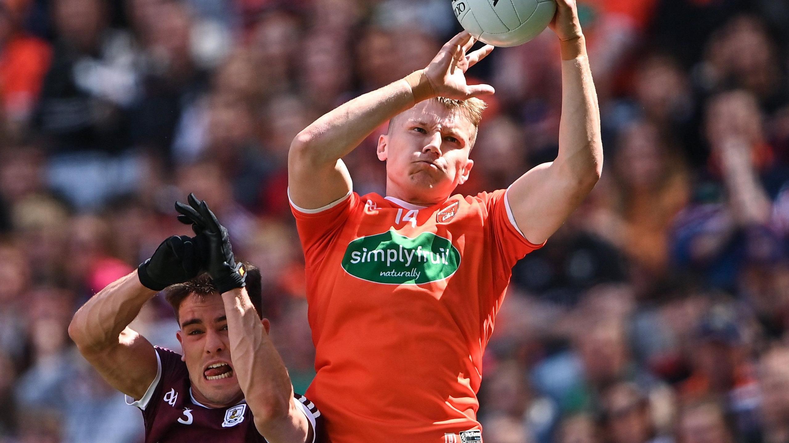 Armagh's Rian O'Neill outfields Galway skipper Sean Kelly to win possession in the 2022 All-Ireland quarter-finals which the Tribesmen won on penalties