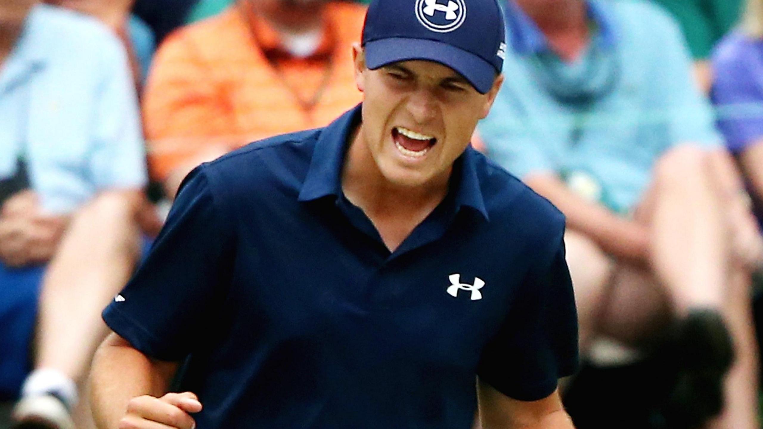 Jordan Spieth celebrates holing a putt