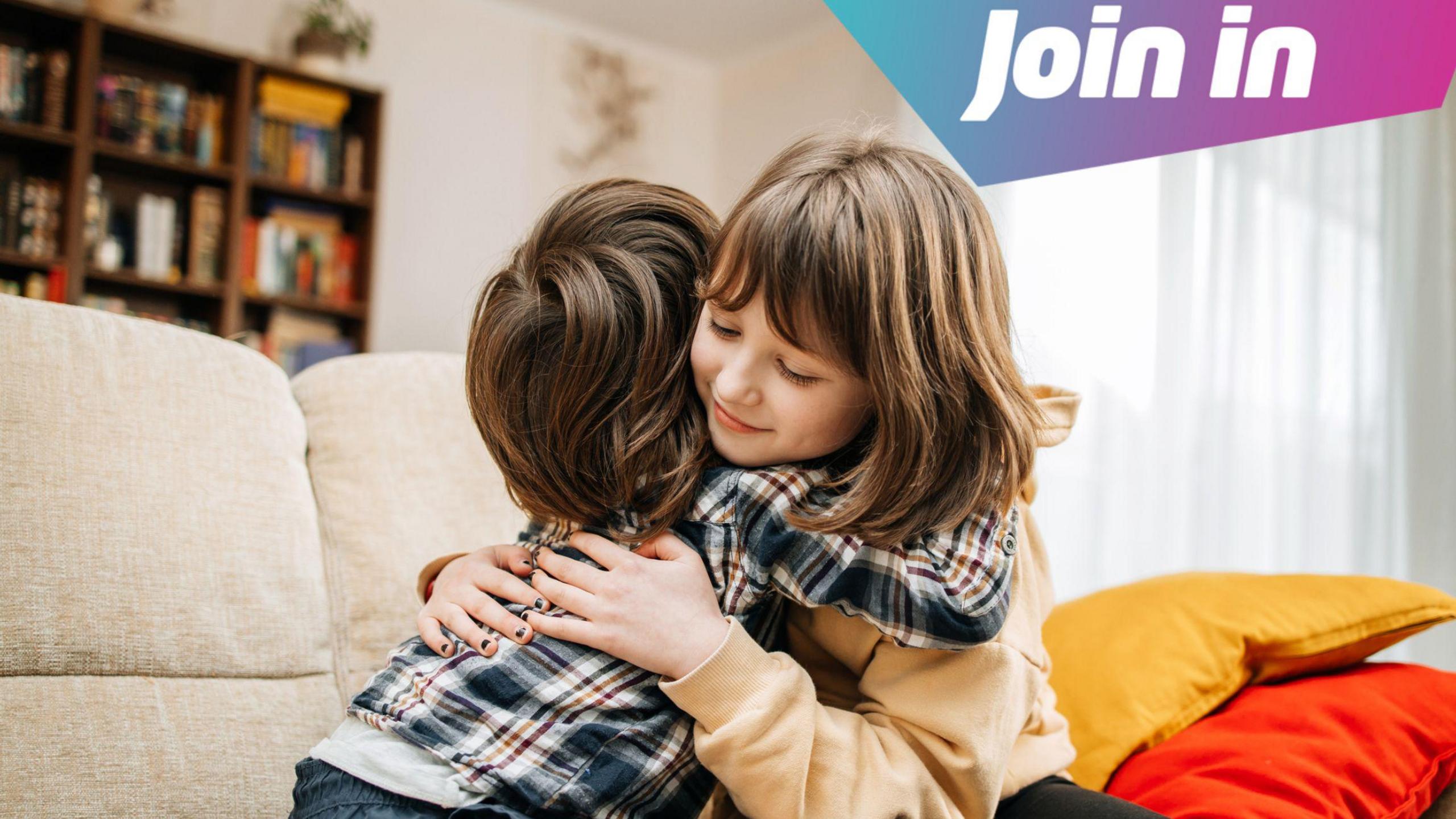 Two children hugging.