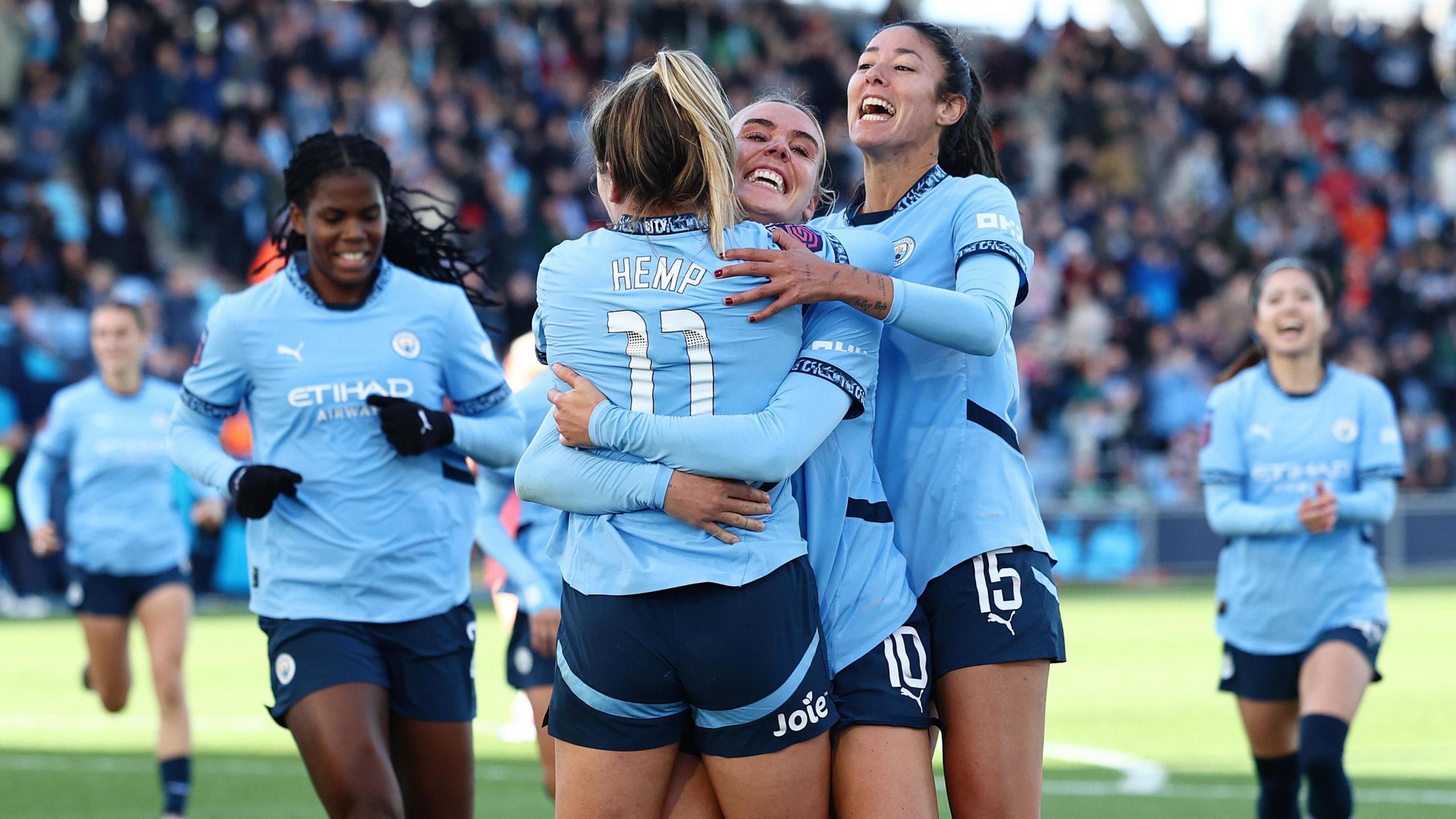 Lauren Hemp and Man City team mates celebrate scoring against Aston Villa