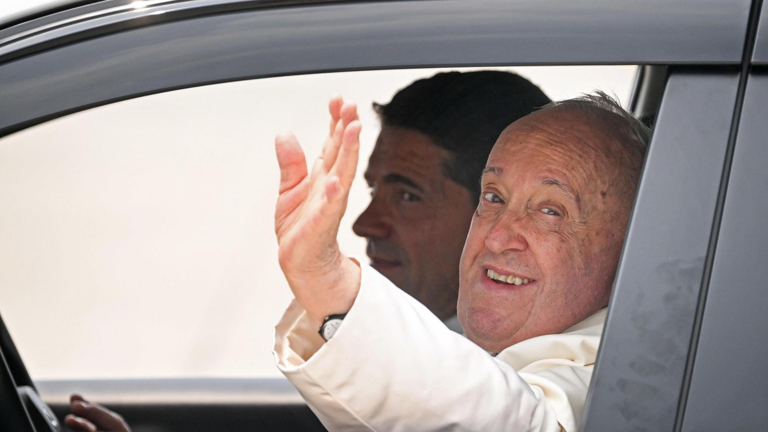 The Pope was smiling and waving upon his arrival 