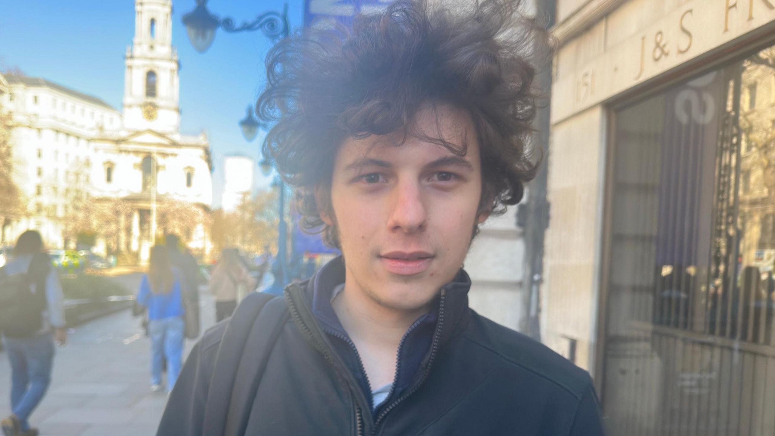 Student Gian Giacomo in a black jacket on The Strand