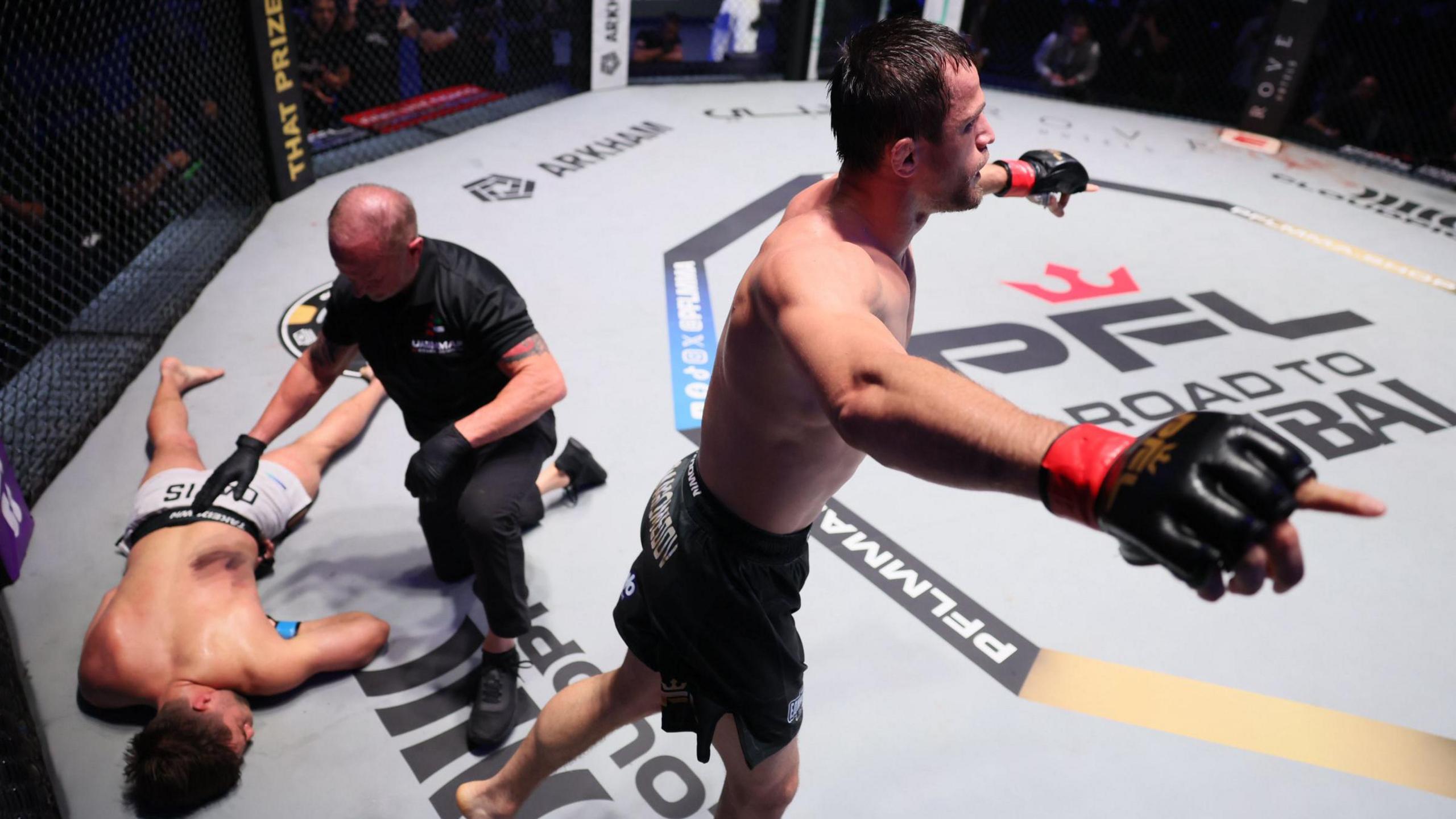 Usman Nurmagomedov celebrates beating Alfie Davis