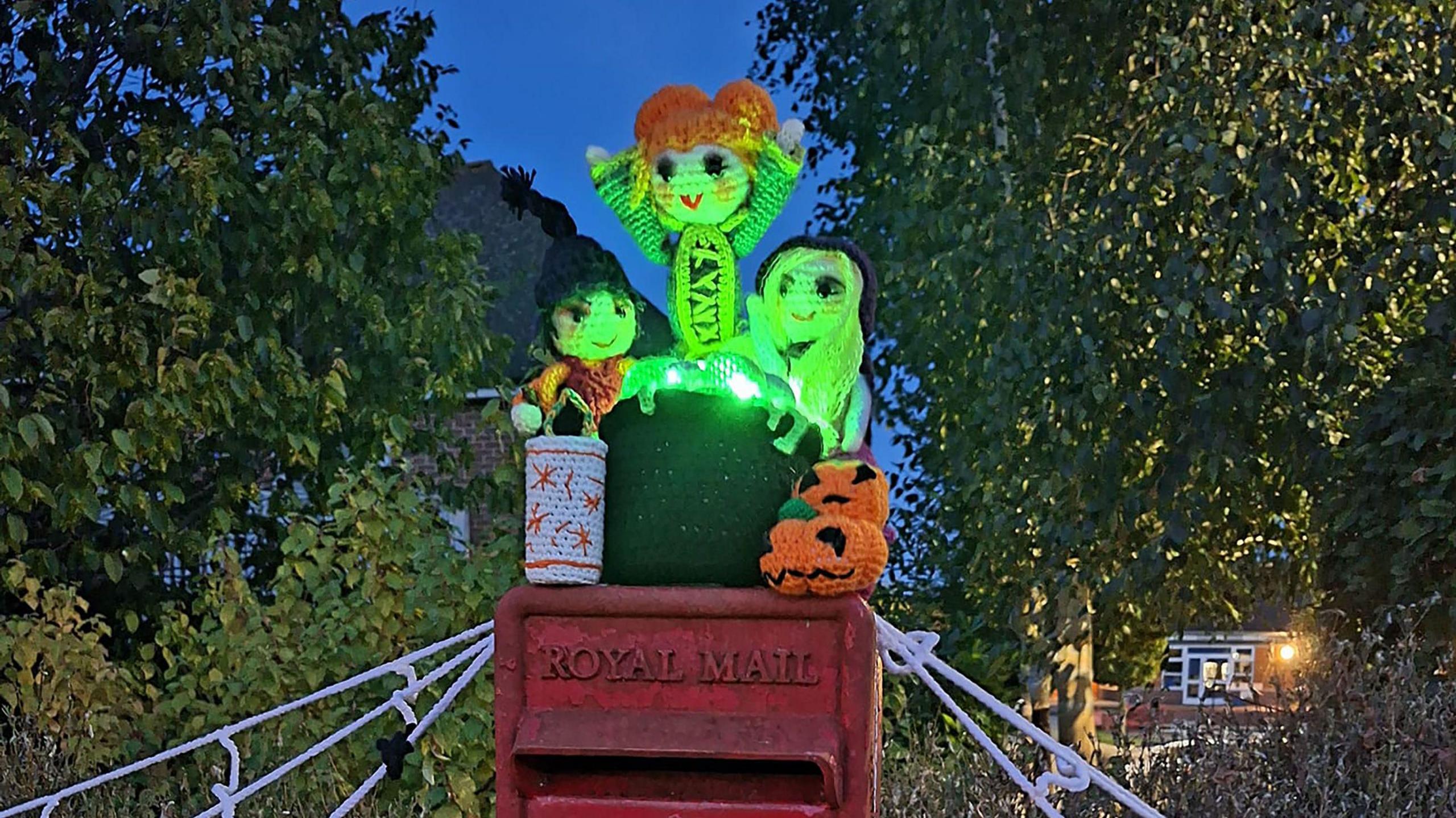 Post box topper of characters from Hocus Pocus film