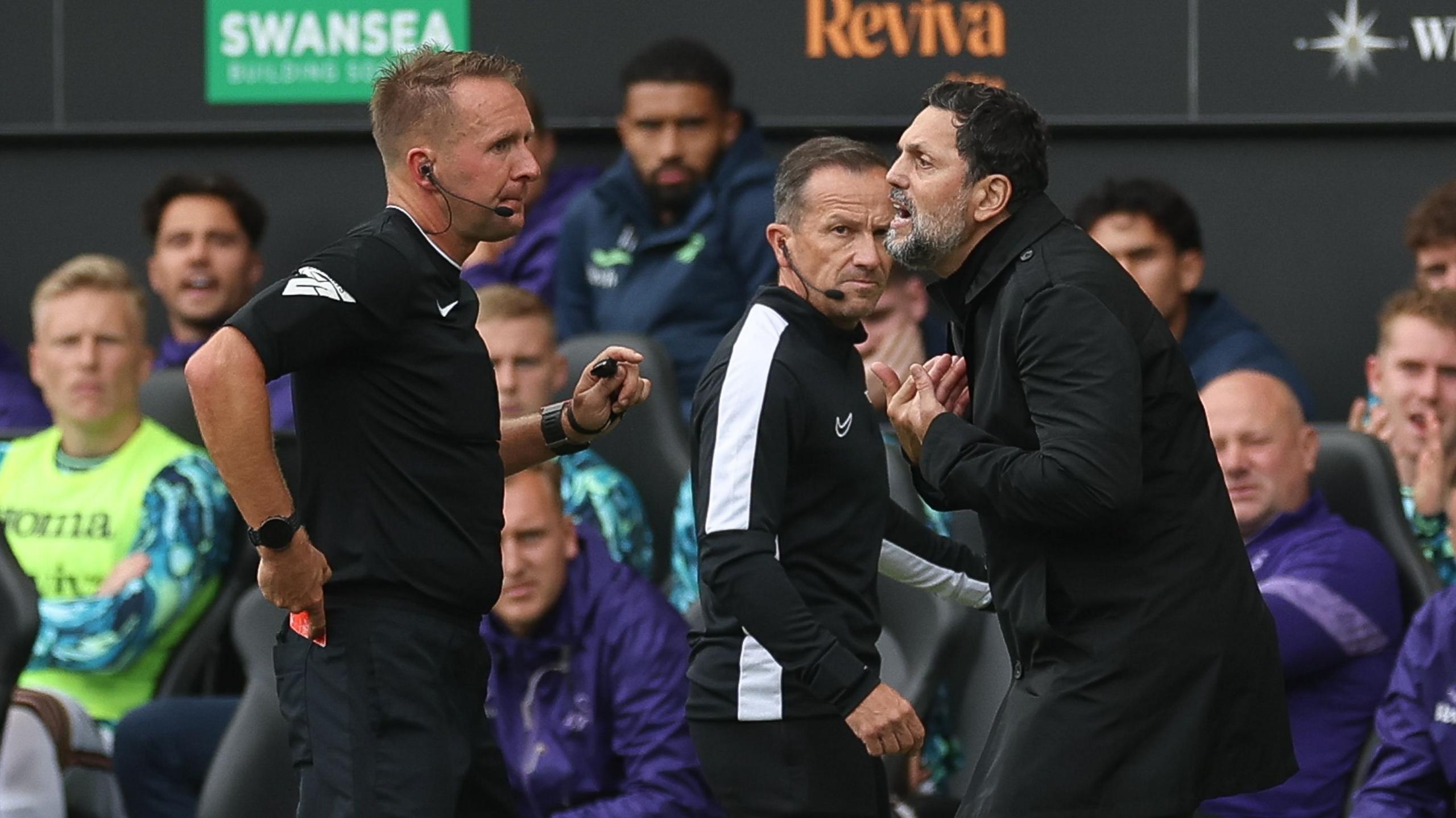 Referee Oliver Langford (L) shows Cardiff City head coach Erol Bulut a red card