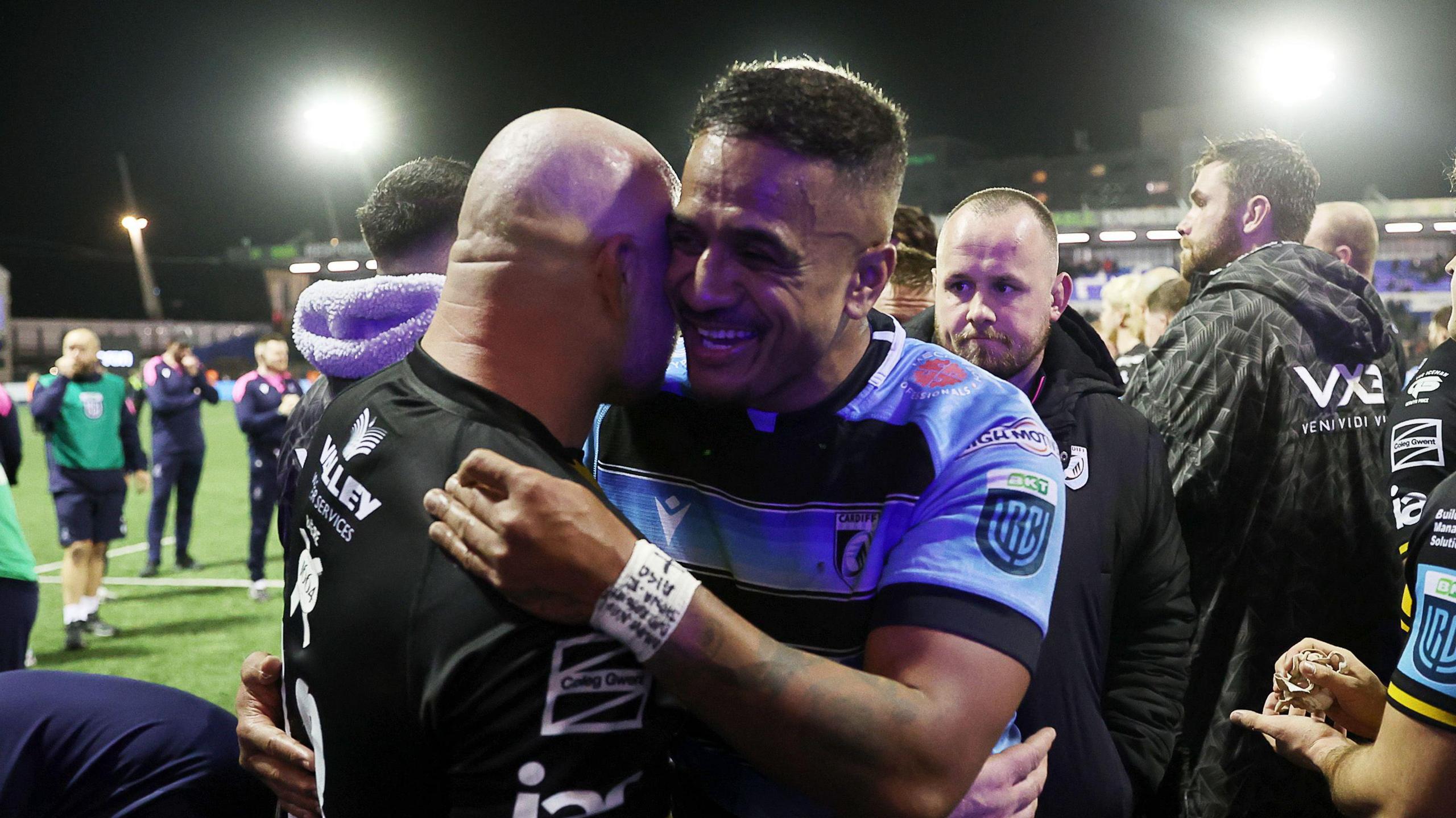 Rey Lee-Lo embraces a Dragons player after match