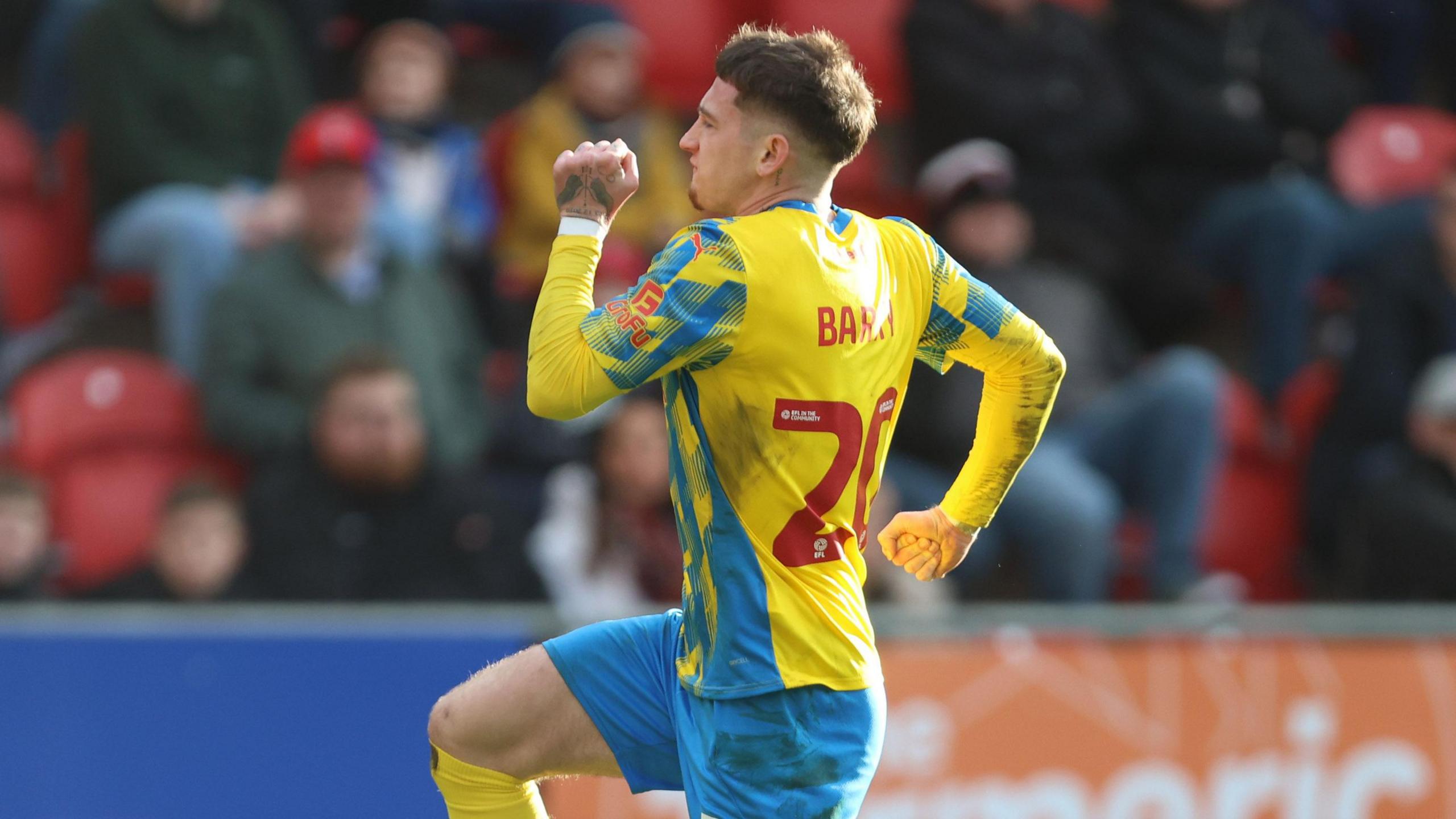 Louie Barry celebrates after scoring against Rotherham United