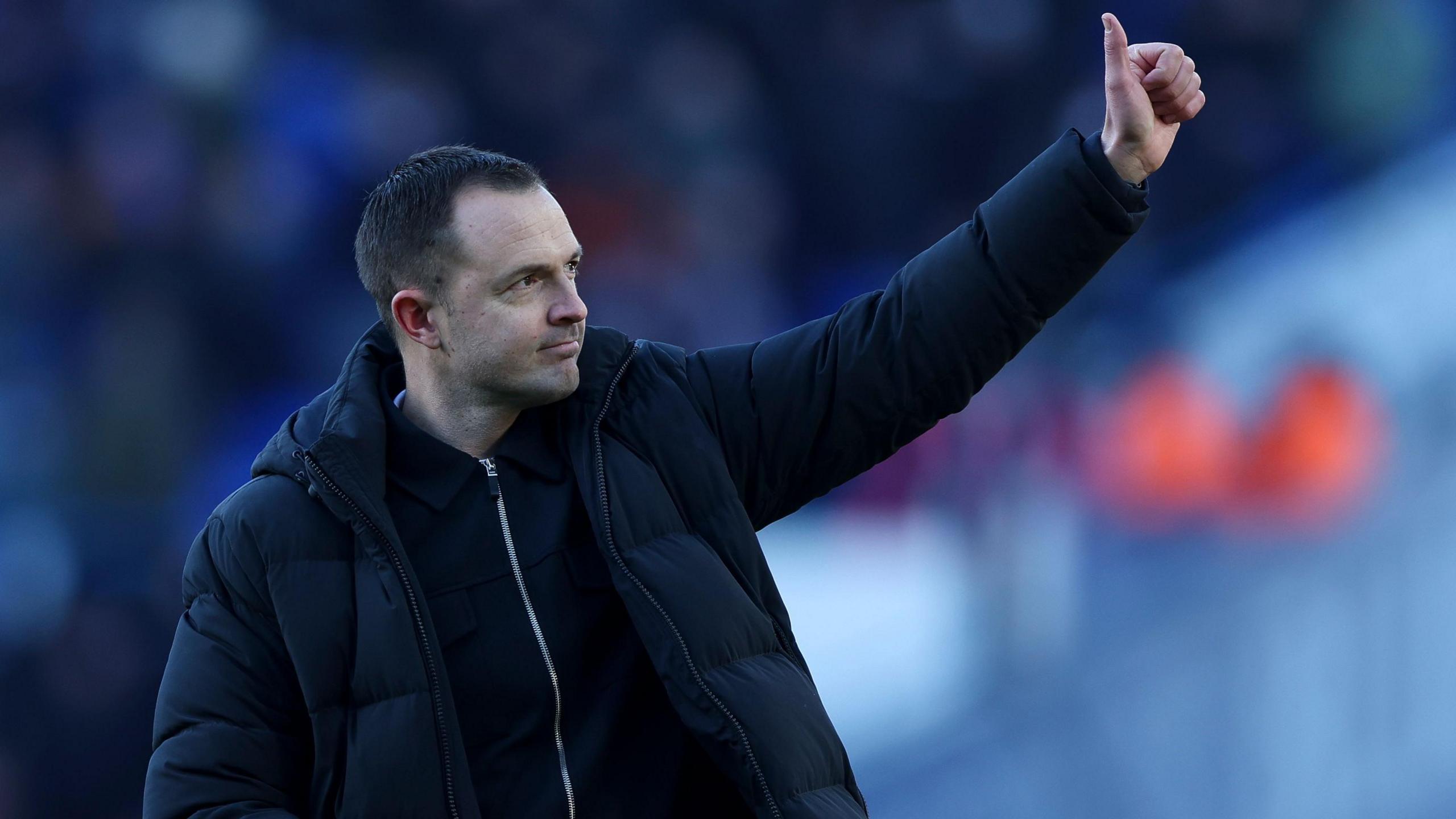 Birmingham City manager Chris Davies gives a thumbs up to the crowd after winning a match 