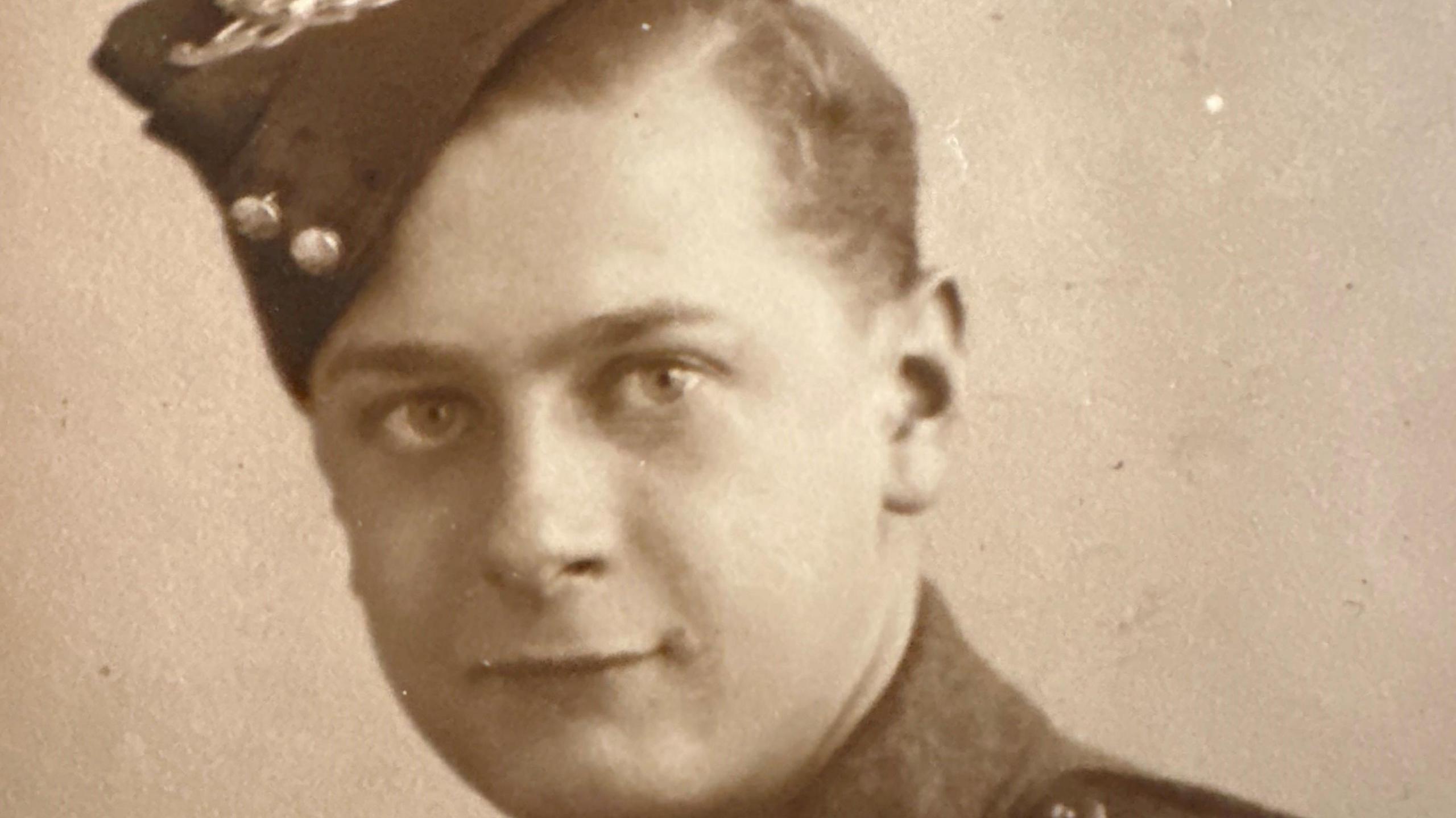 A sepia photograph of a young James Fenton in his Lancashire Fusiliers uniform.