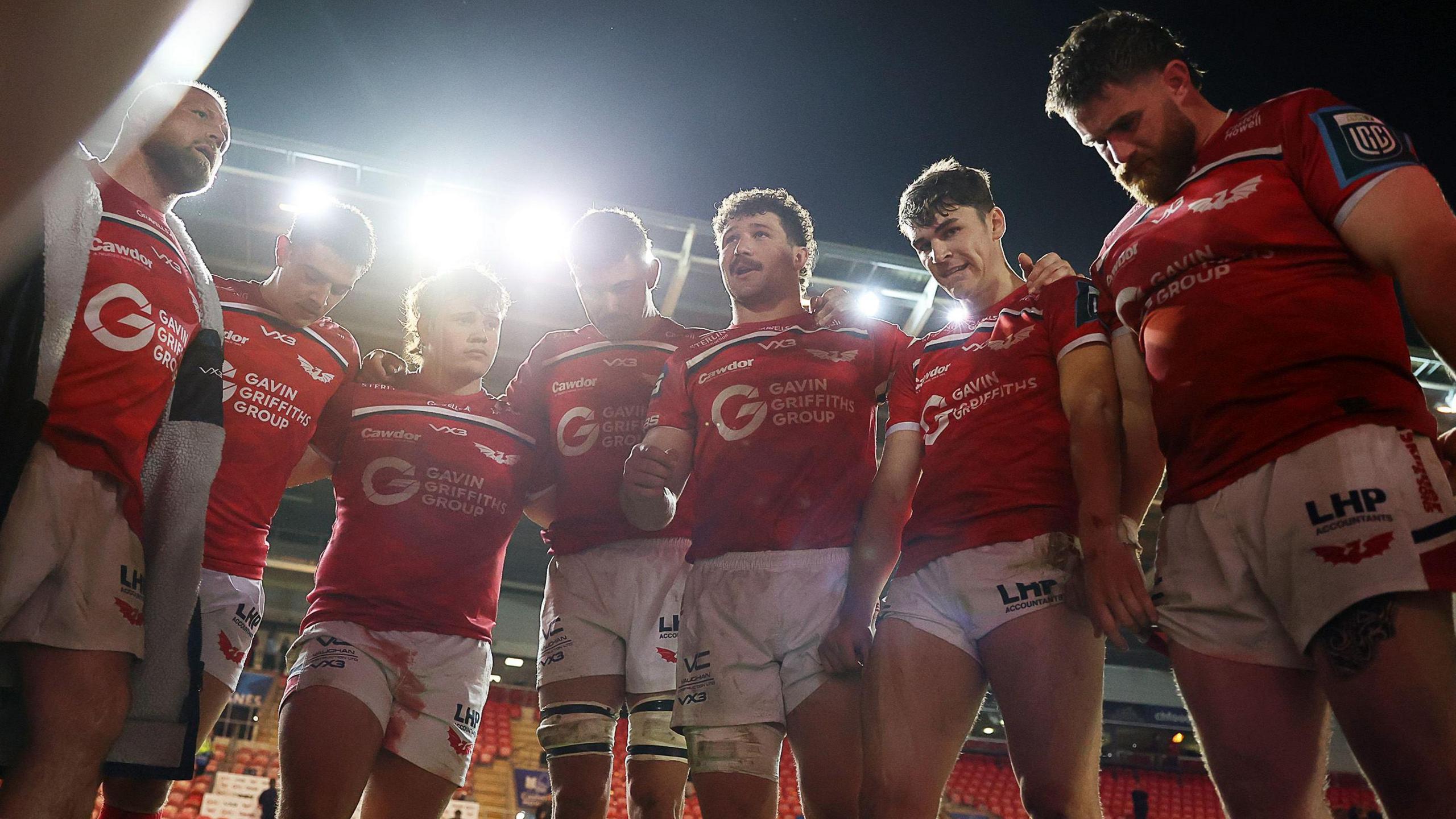 Scarlets, in a post-match huddle