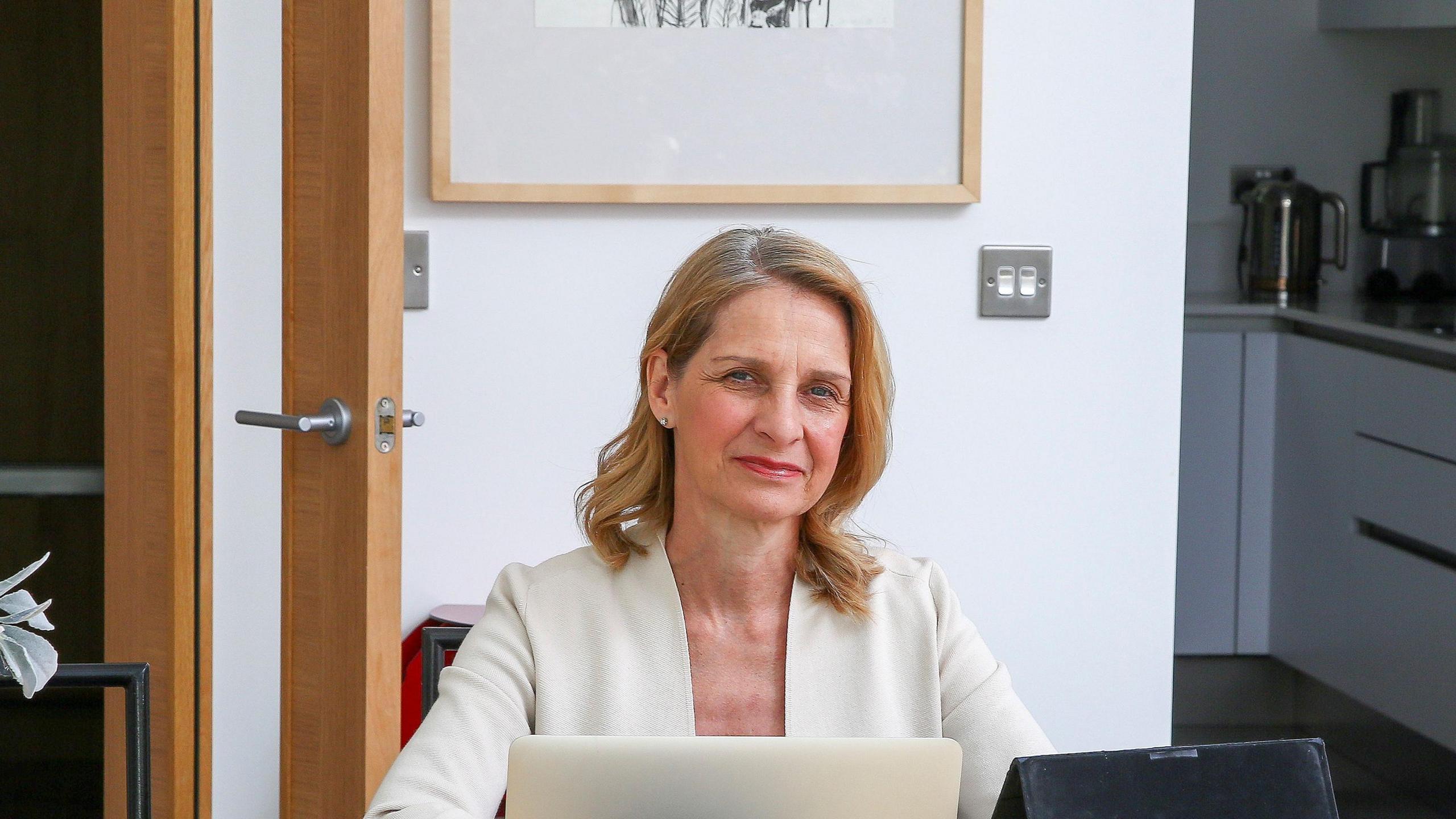 Wera Hobhouse sitting near laptop in office