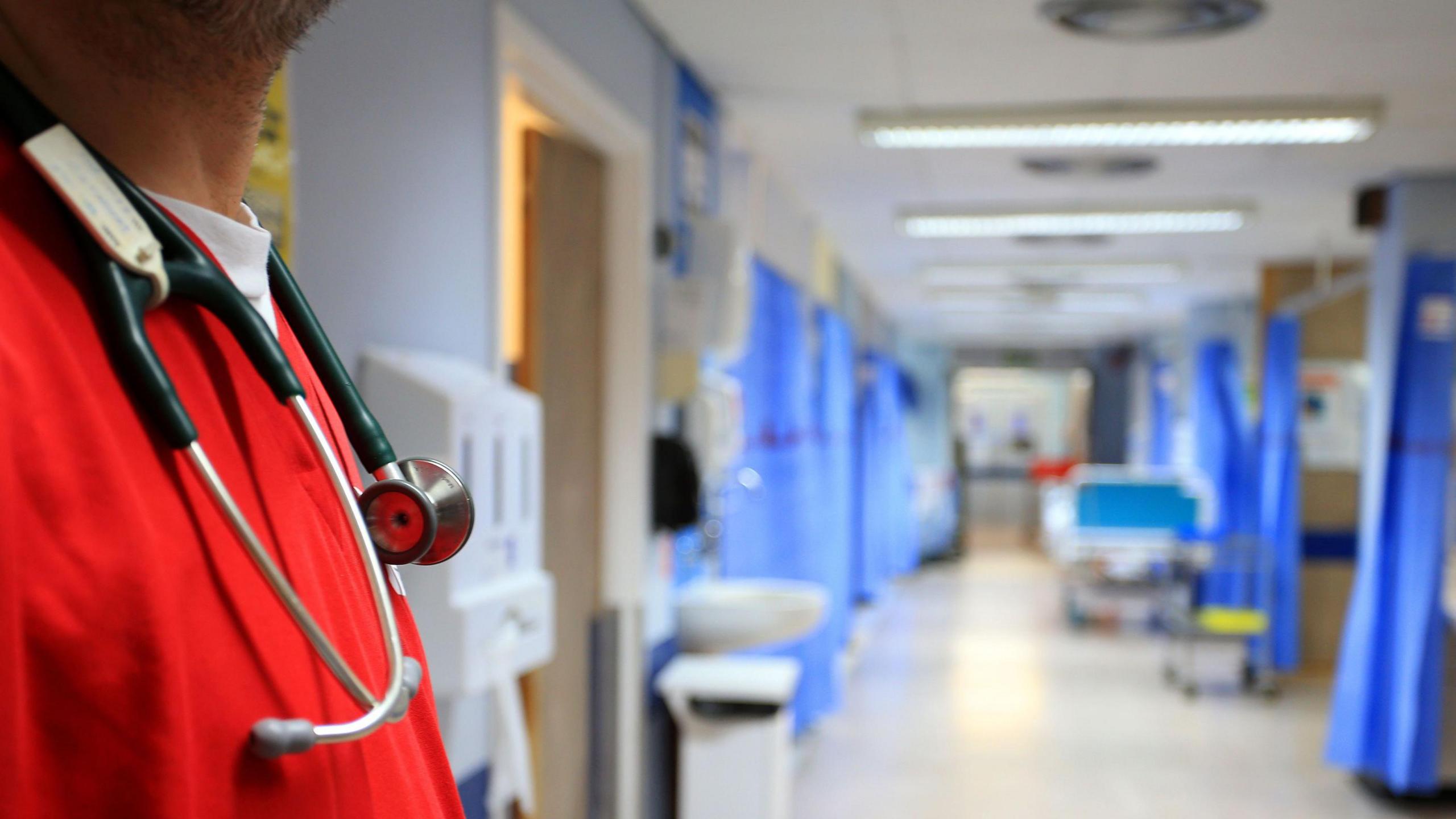 A health professional on a hospital ward