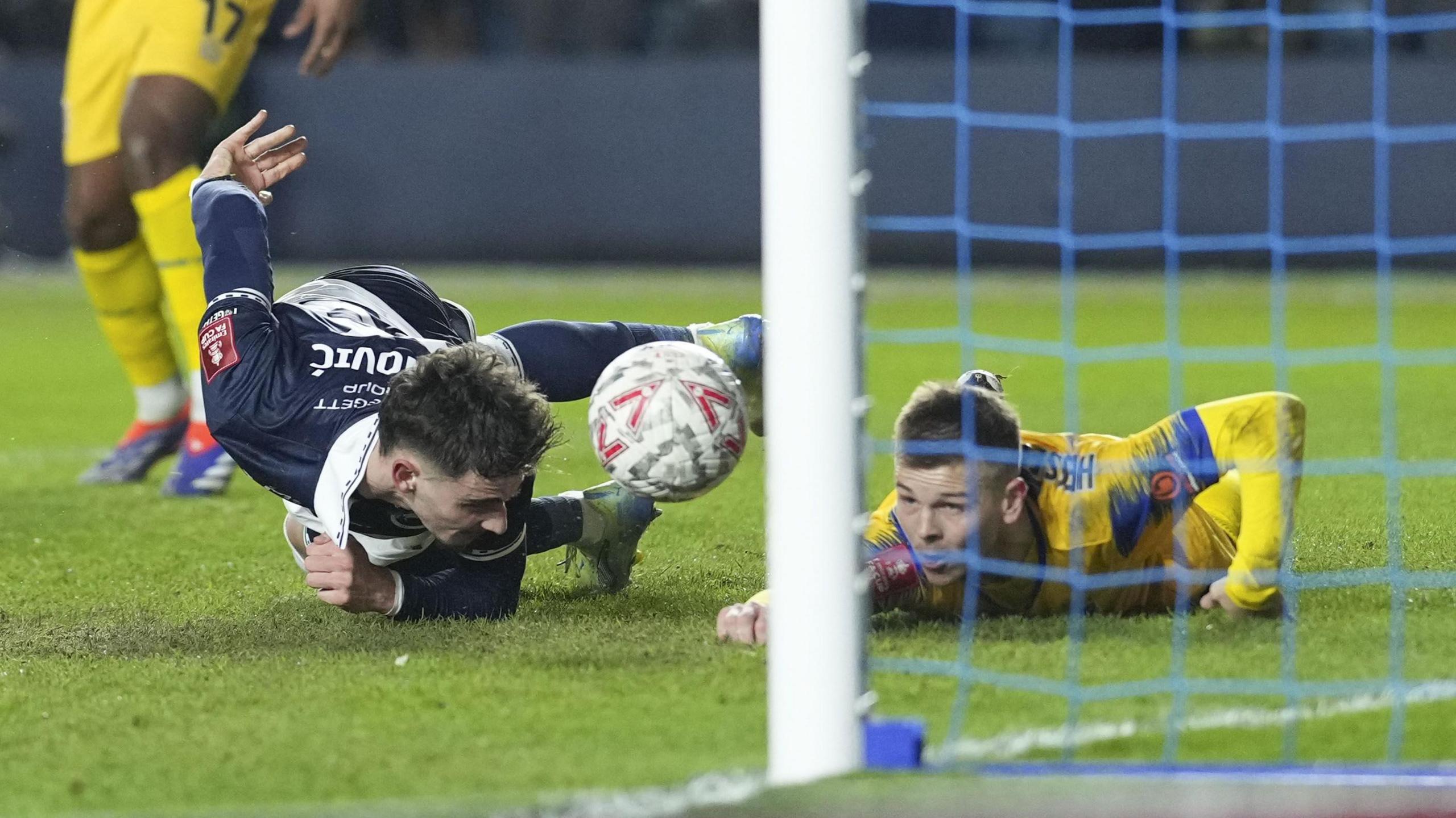 Mihailo Ivanovic scores with a header while laying on the ground against Dagenham & Redbridge