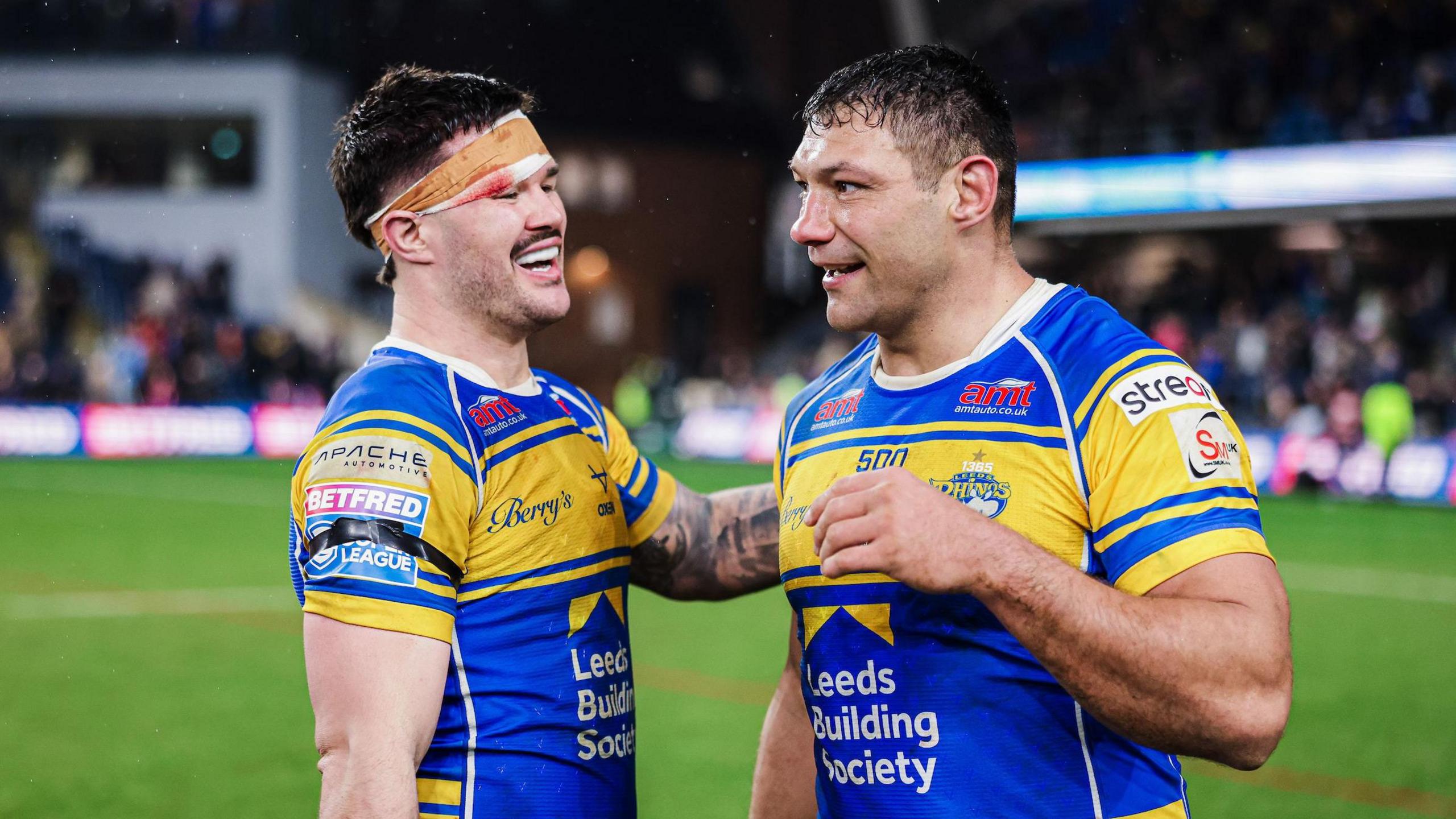 James Bentley (left) and Ryan Hall (right) celebrate Leeds' win over Wigan