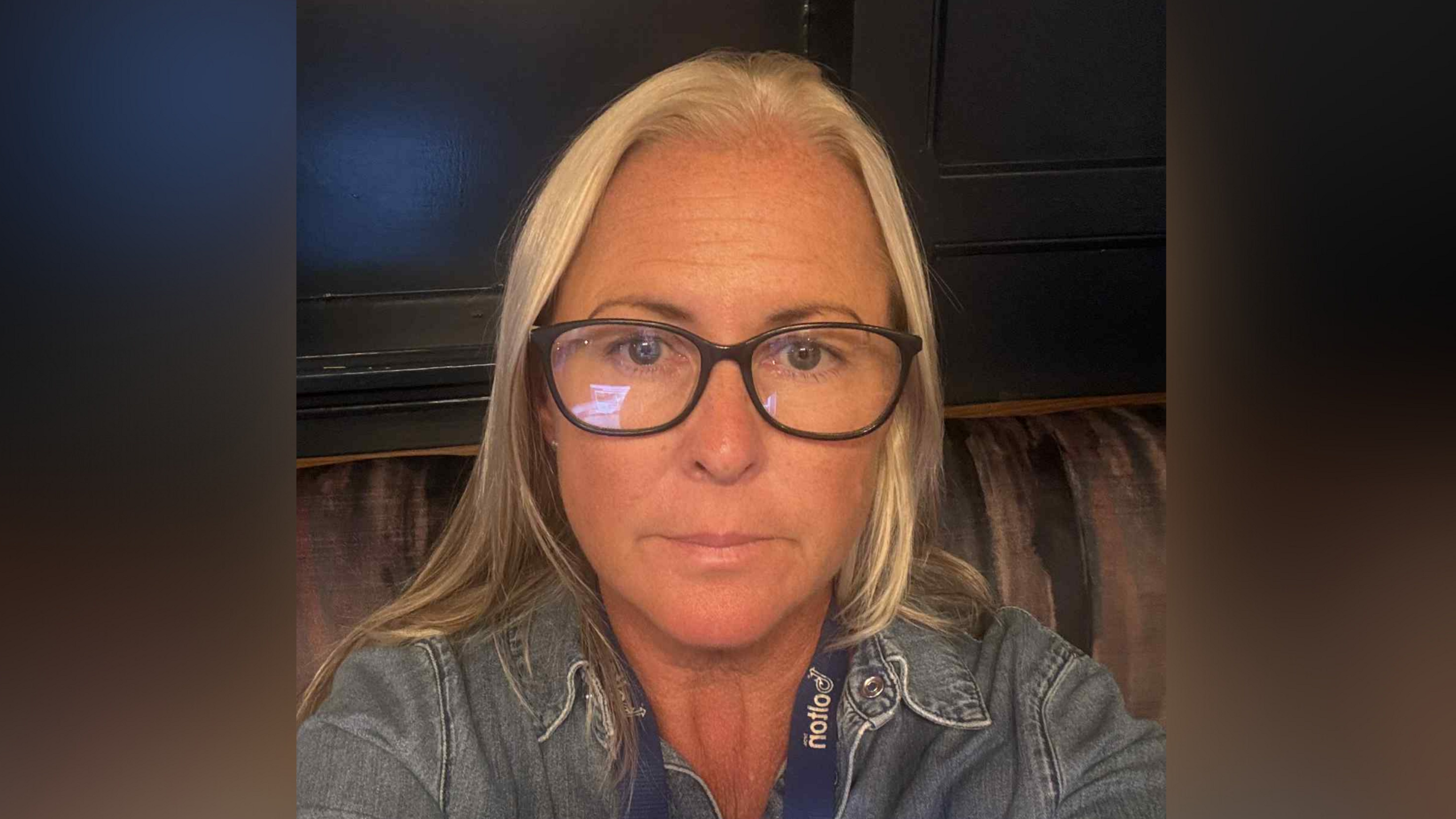 A head and shoulders image of Hollie Newton wearing glasses and denim jacket. She is looking into the camera.