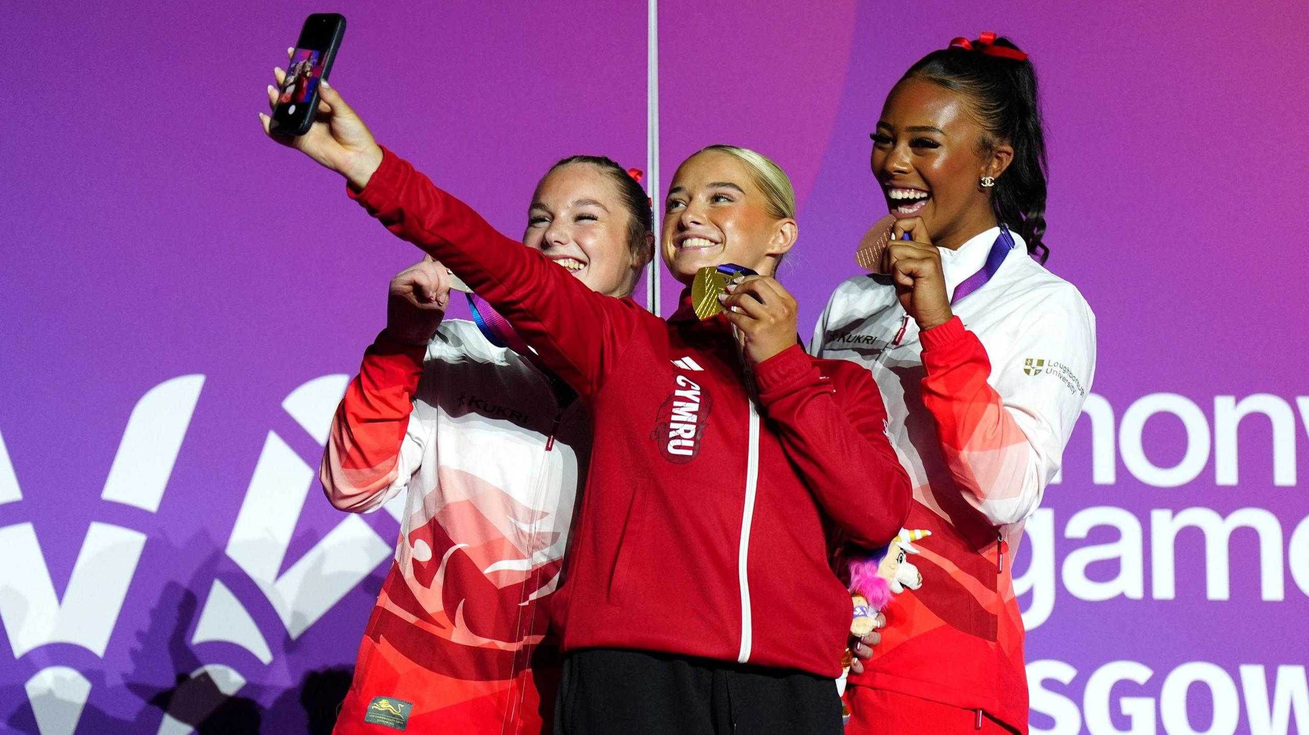 Gymnasts Abi Martin (left), Ruby Evans (middle) and Shantae-Eve Amankwaah (right) pose for a photo with their Commonwealth Games medals after the ceremony