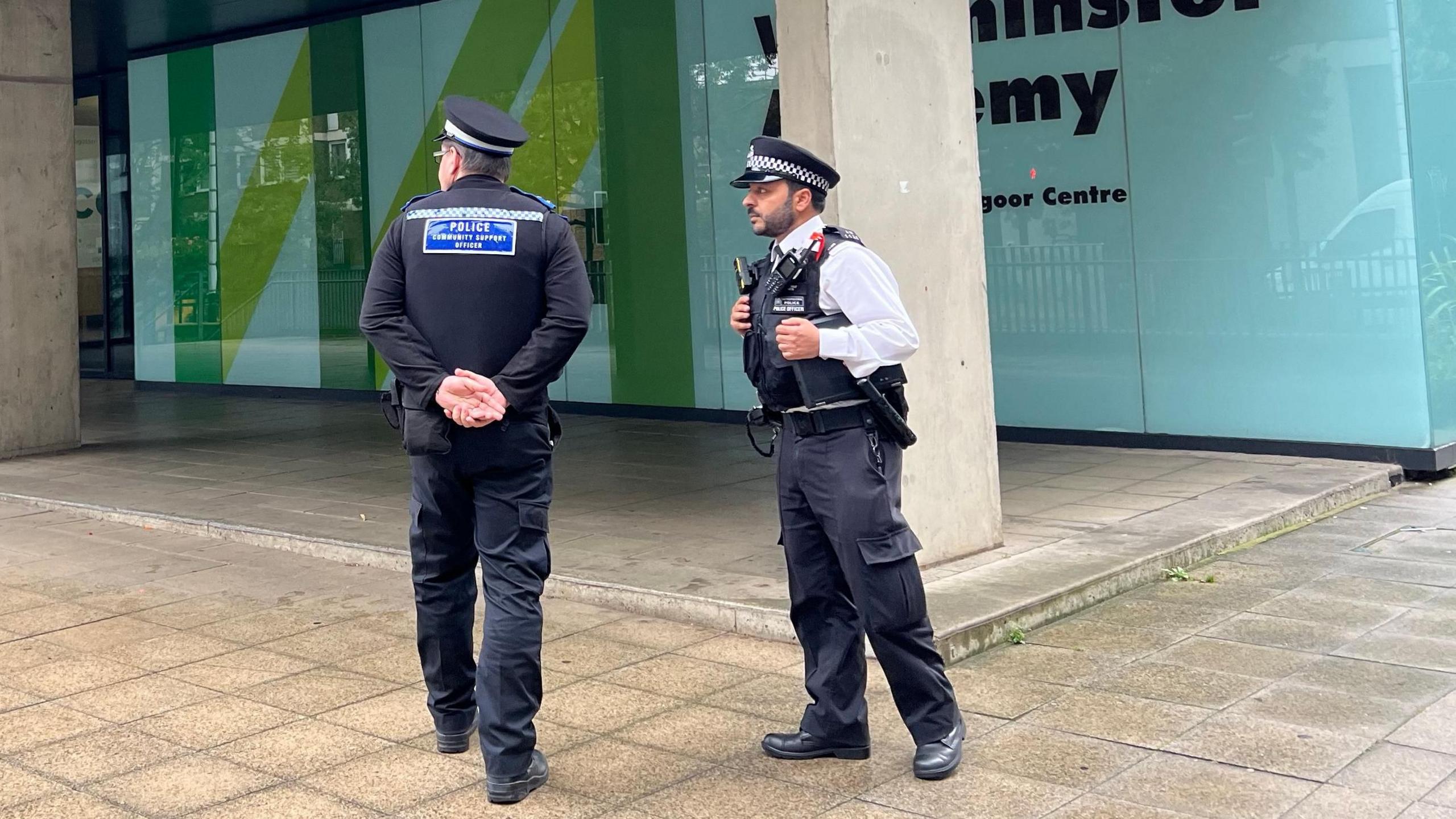 Police officers stands outside Westminster Academy