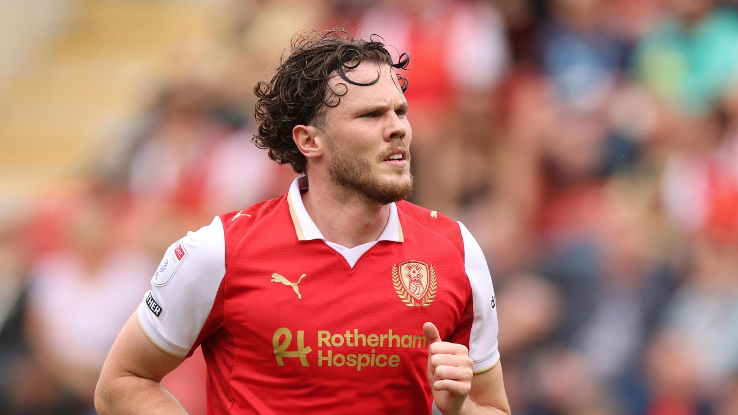 Thomas Holmes playing for Rotherham against Exeter