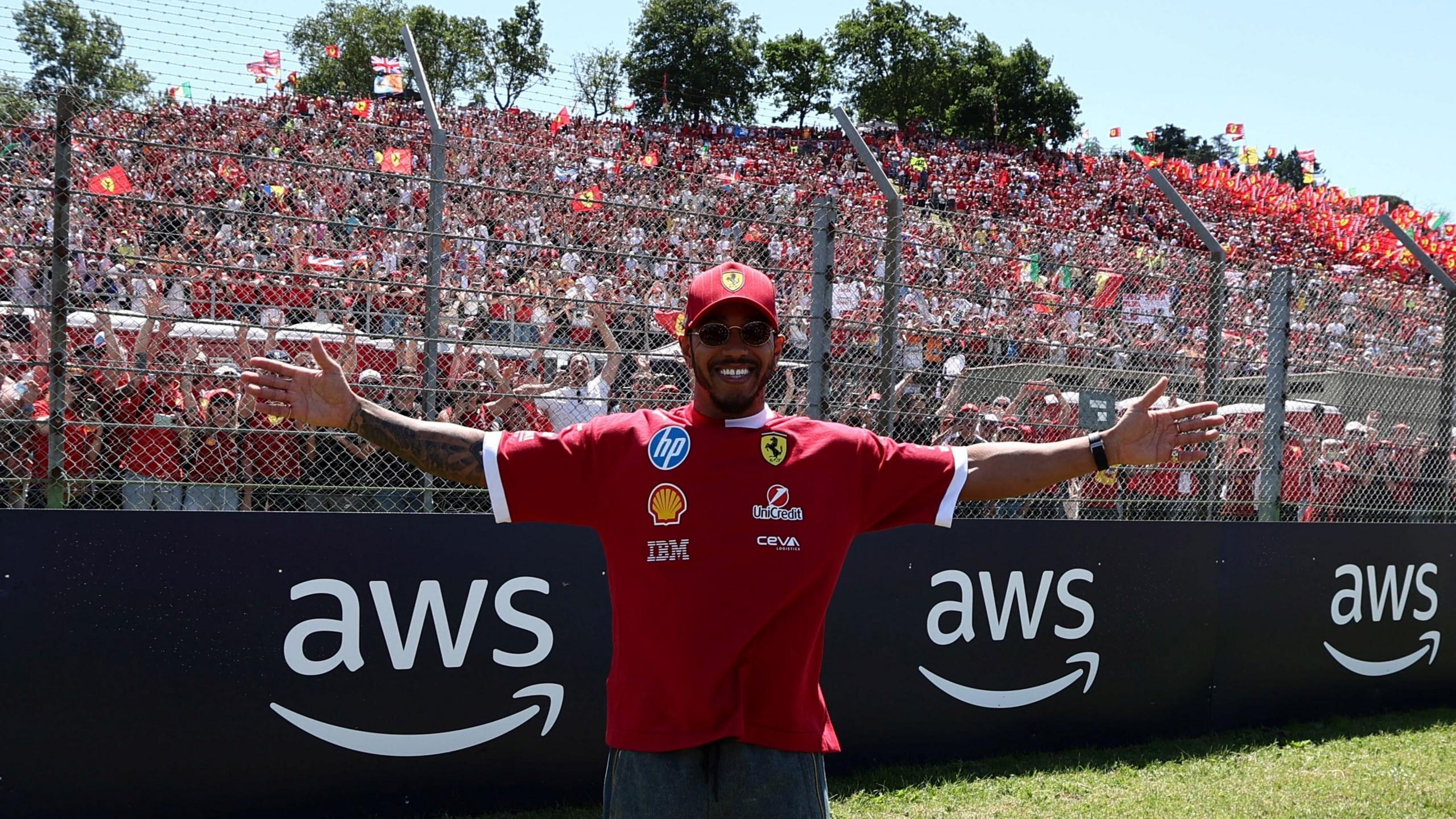 Lewis Hamilton with his arms outstretched in front of a grandstand of Ferrari fans before the Emilia-Romagna Grand Prix on Sunday