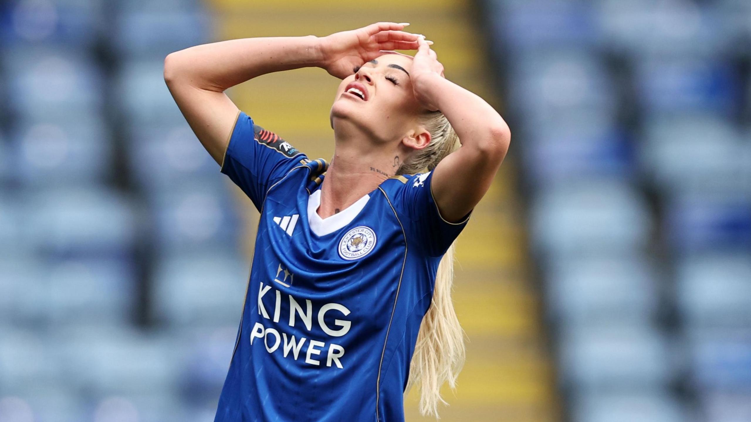 Alisha Lehmann holds her hands to her head in frustration