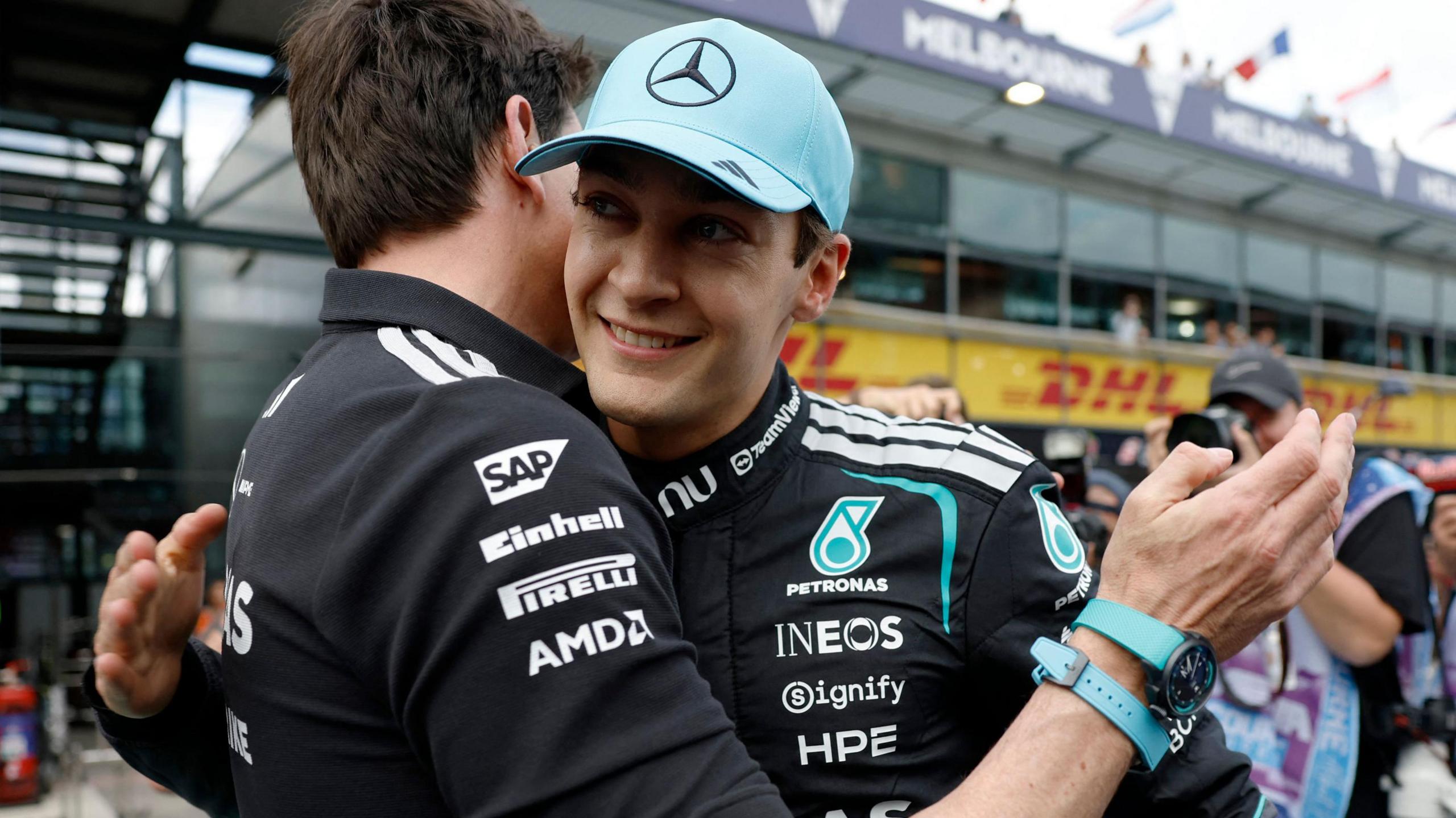 George Russell hugs Mercedes team boss Toto Wolff after taking pole position for the Australian Grand Prix