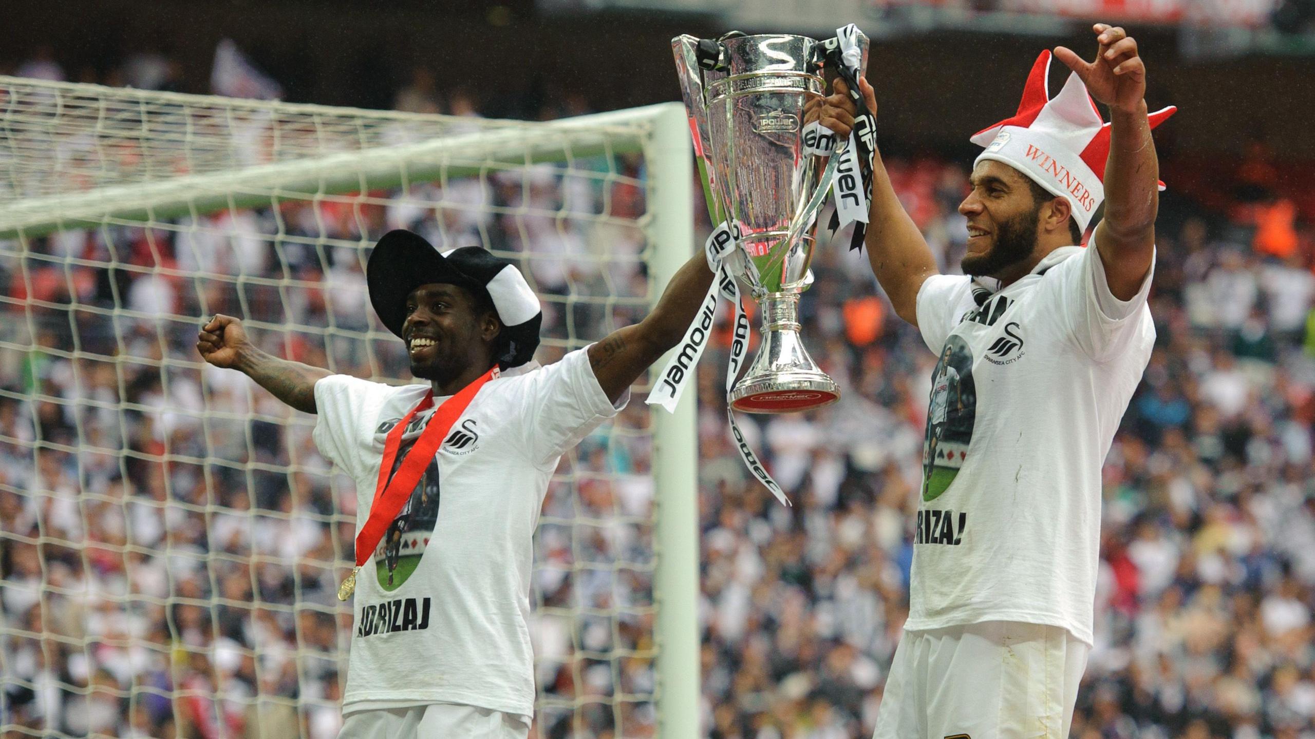 Nathan Dyer and Ashley Williams lift the play-off final trophy